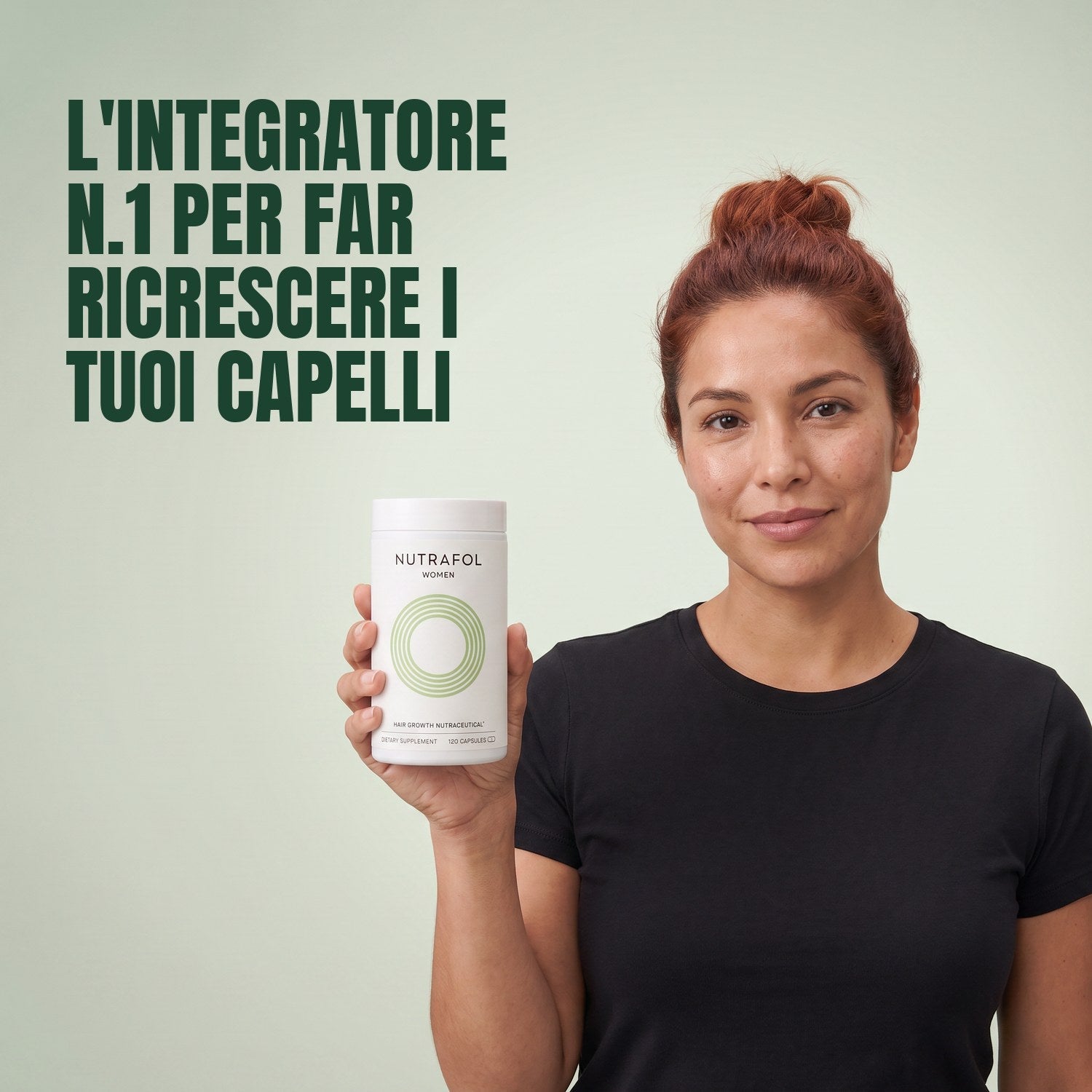 Woman holding the Nutrafol for Women 18-44 supplement box against a green background