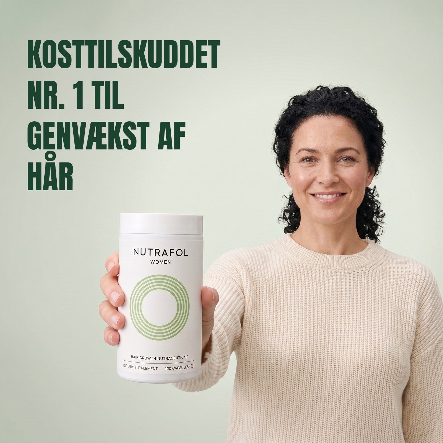 Woman holding the Nutrafol for Women 18-44 supplement box against a green background