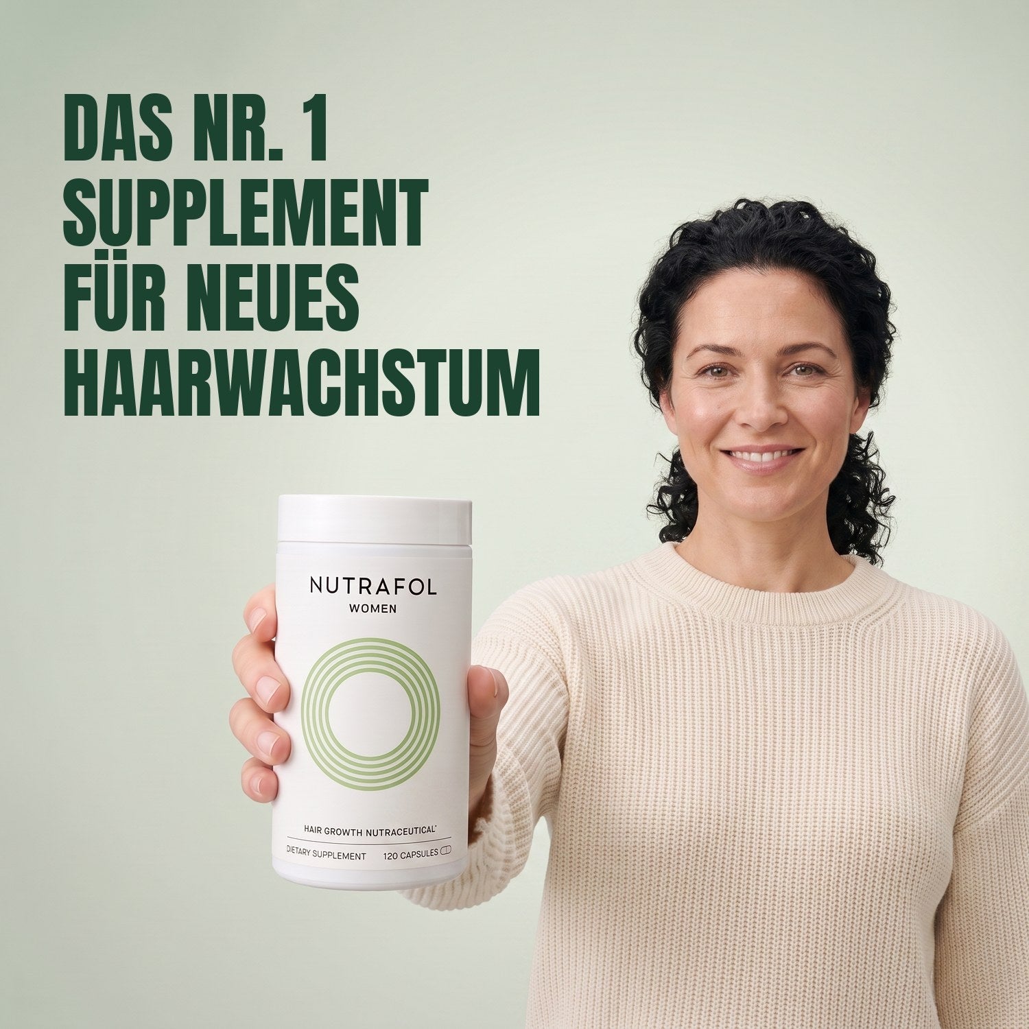 Woman holding the Nutrafol for Women 18-44 supplement box against a green background