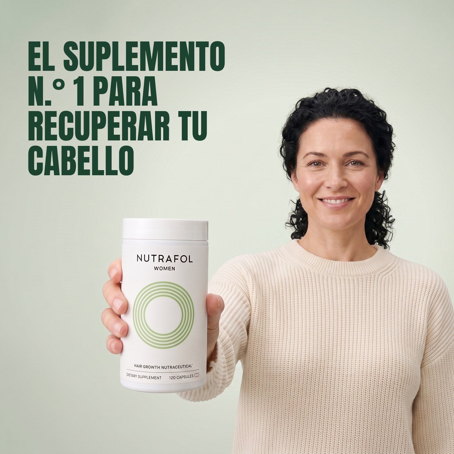 Woman holding the Nutrafol for Women 18-44 supplement box against a green background