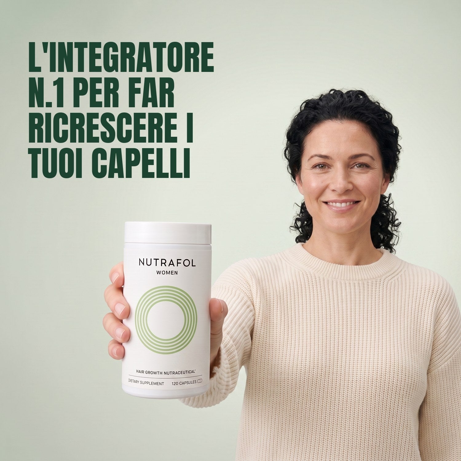 Woman holding the Nutrafol for Women 18-44 supplement box against a green background
