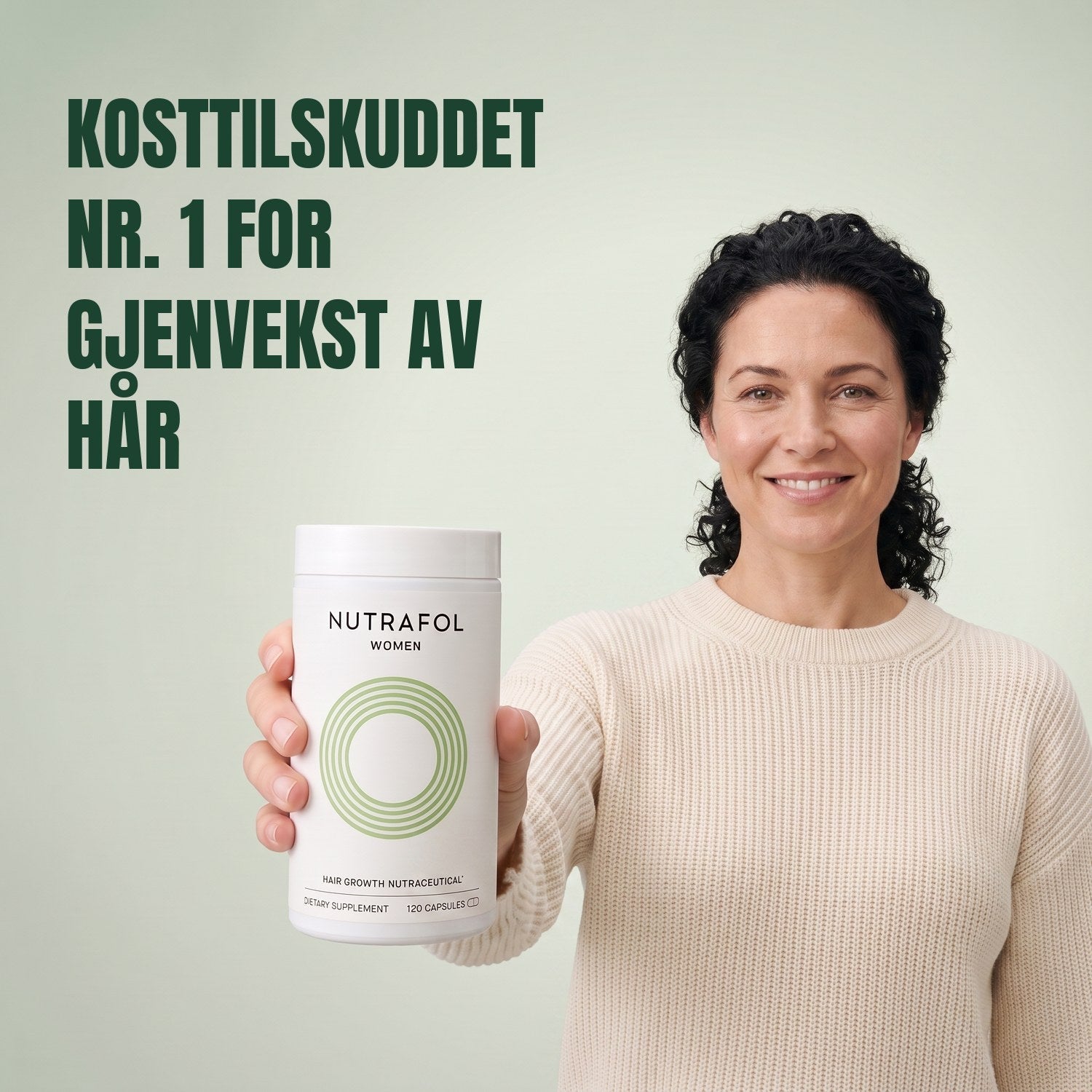Woman holding the Nutrafol for Women 18-44 supplement box against a green background