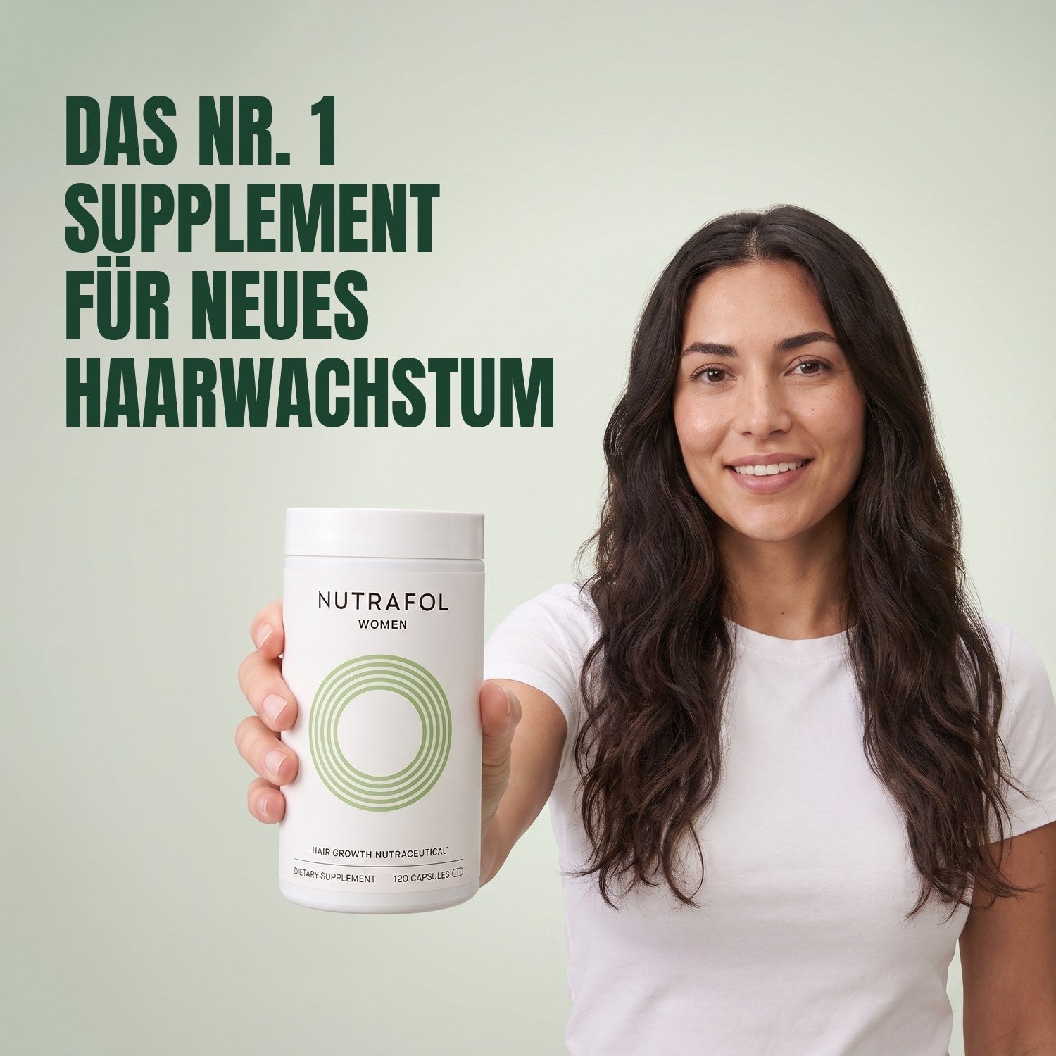 Woman holding the Nutrafol for Women 18-44 supplement box against a green background