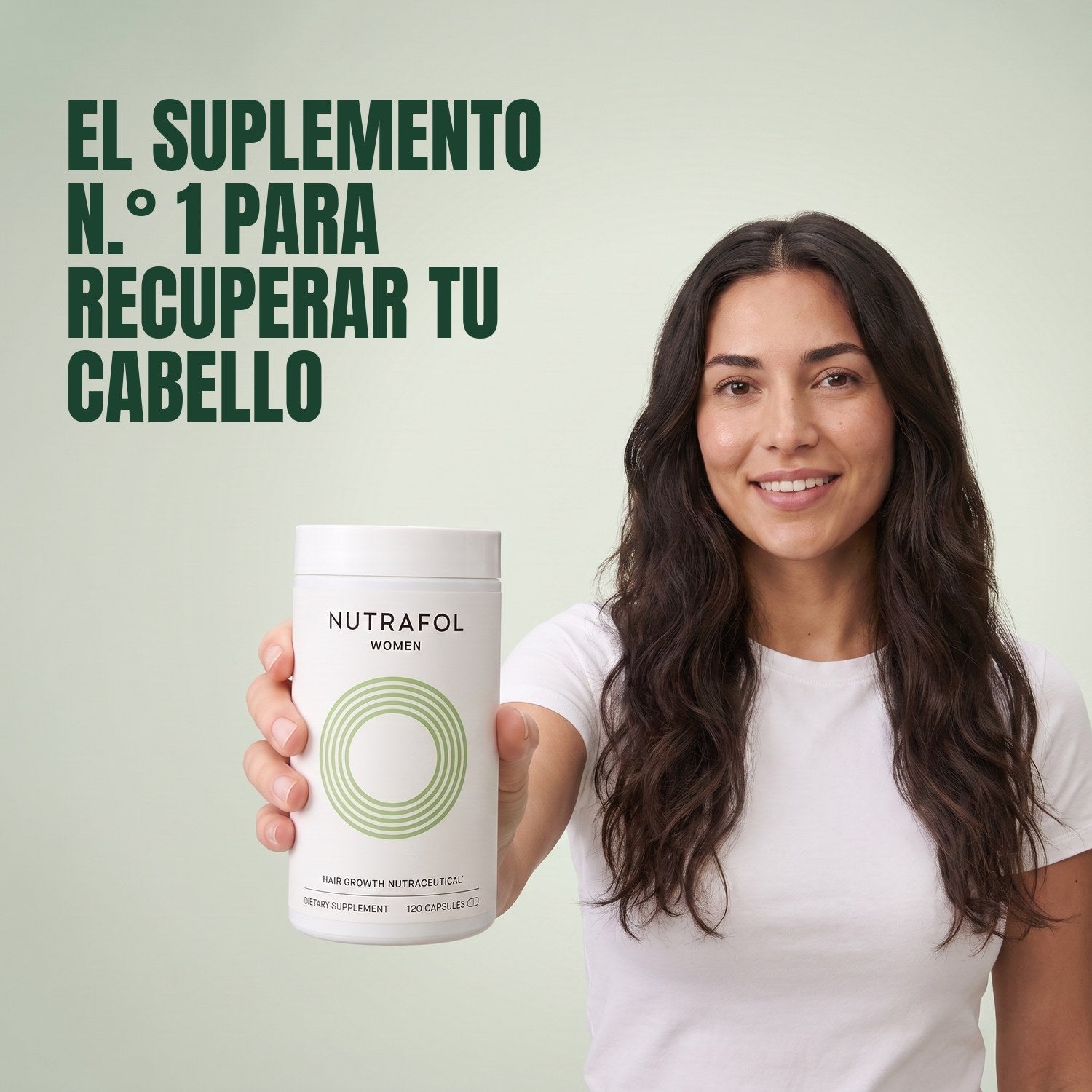 Woman holding the Nutrafol for Women 18-44 supplement box against a green background