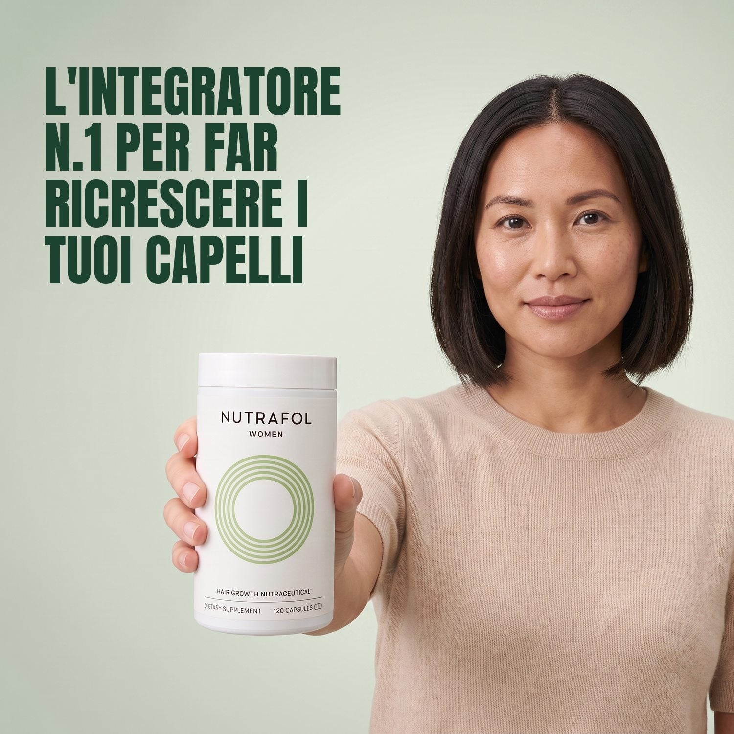 Woman holding the Nutrafol for Women 18-44 supplement box against a green background