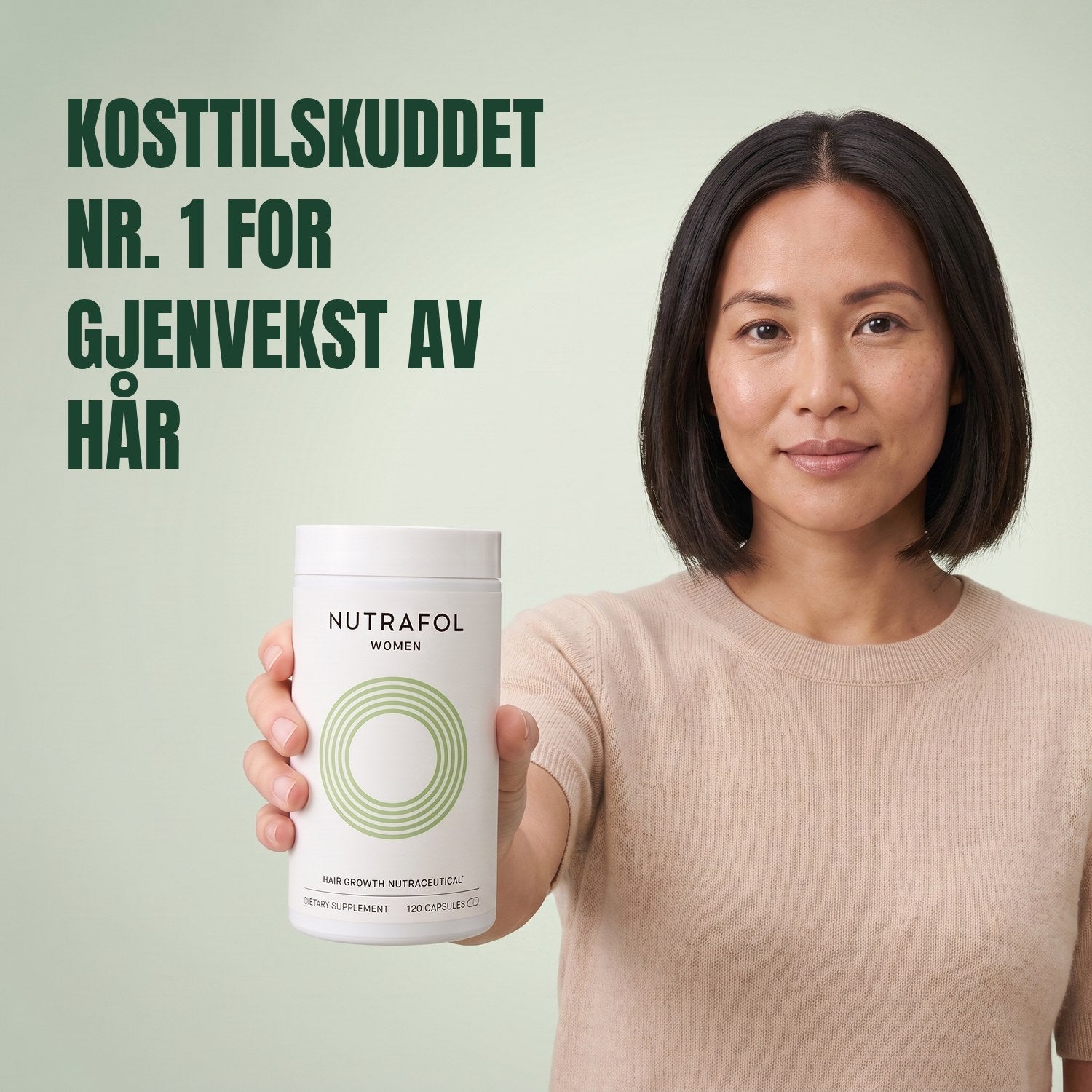 Woman holding the Nutrafol for Women 18-44 supplement box against a green background