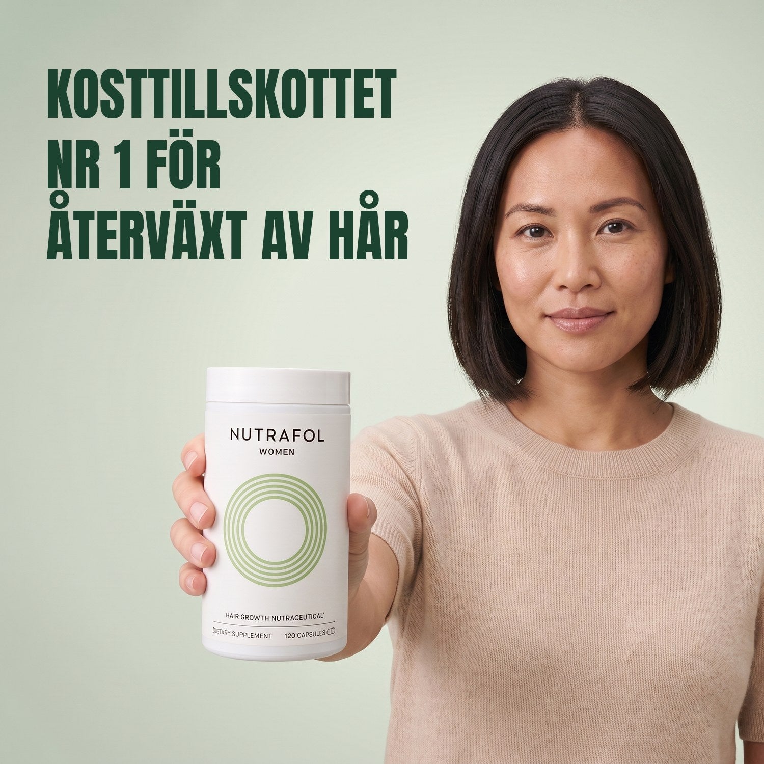 Woman holding the Nutrafol for Women 18-44 supplement box against a green background