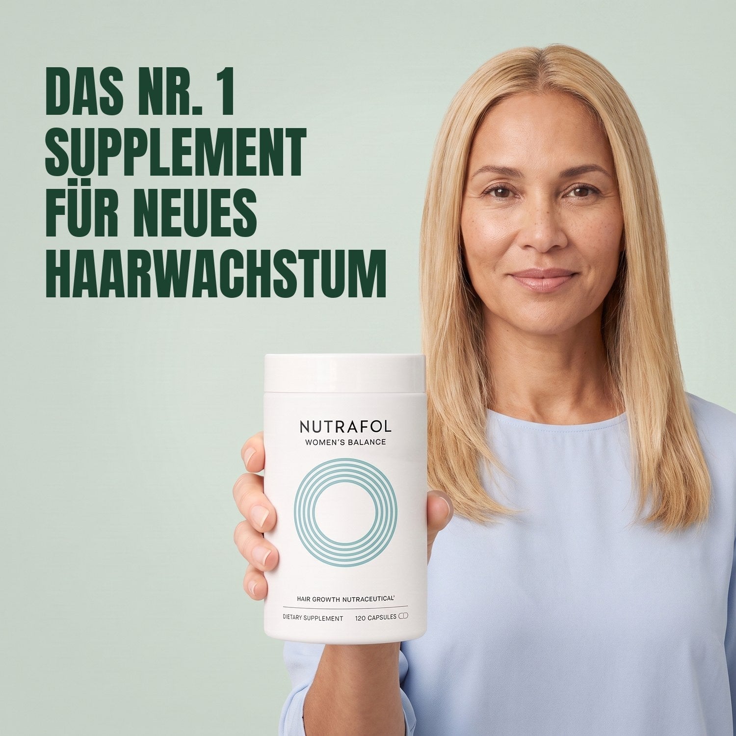 Woman holding the Nutrafol for Women 45+ supplement box against a green background