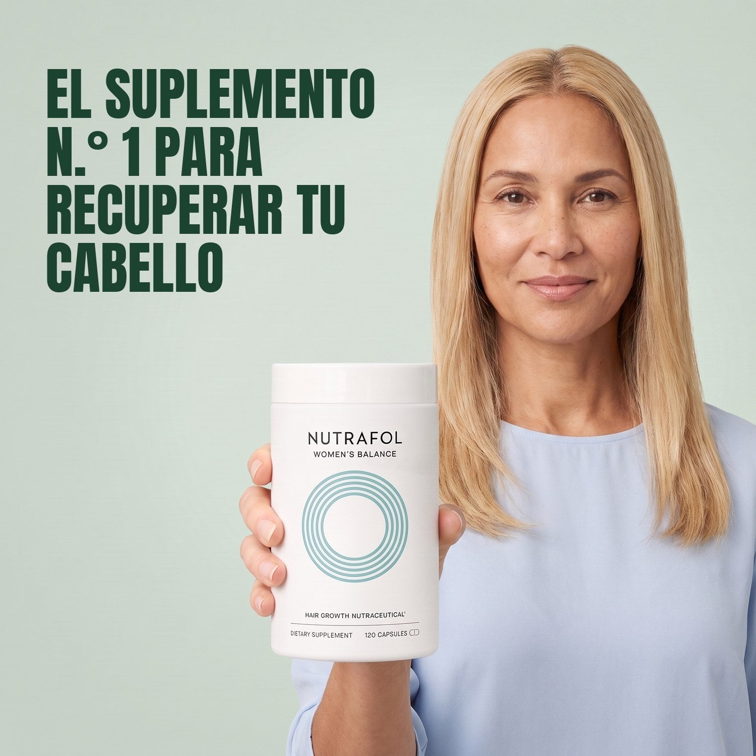 Woman holding the Nutrafol for Women 45+ supplement box against a green background