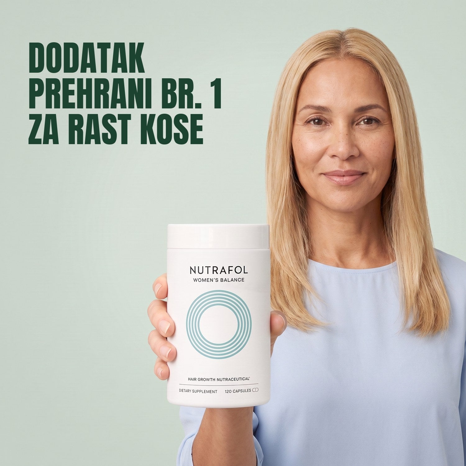 Woman holding the Nutrafol for Women 45+ supplement box against a green background