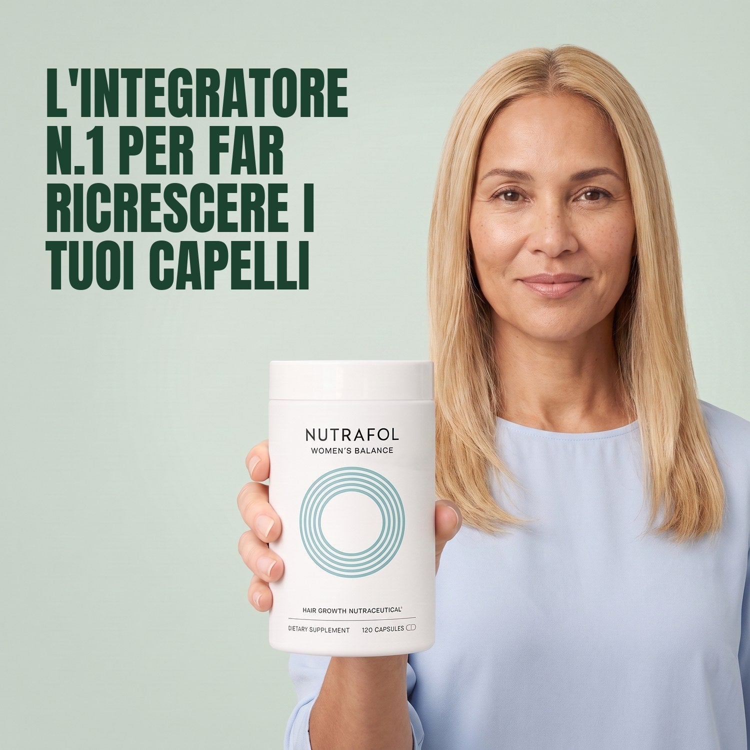 Woman holding the Nutrafol for Women 45+ supplement box against a green background