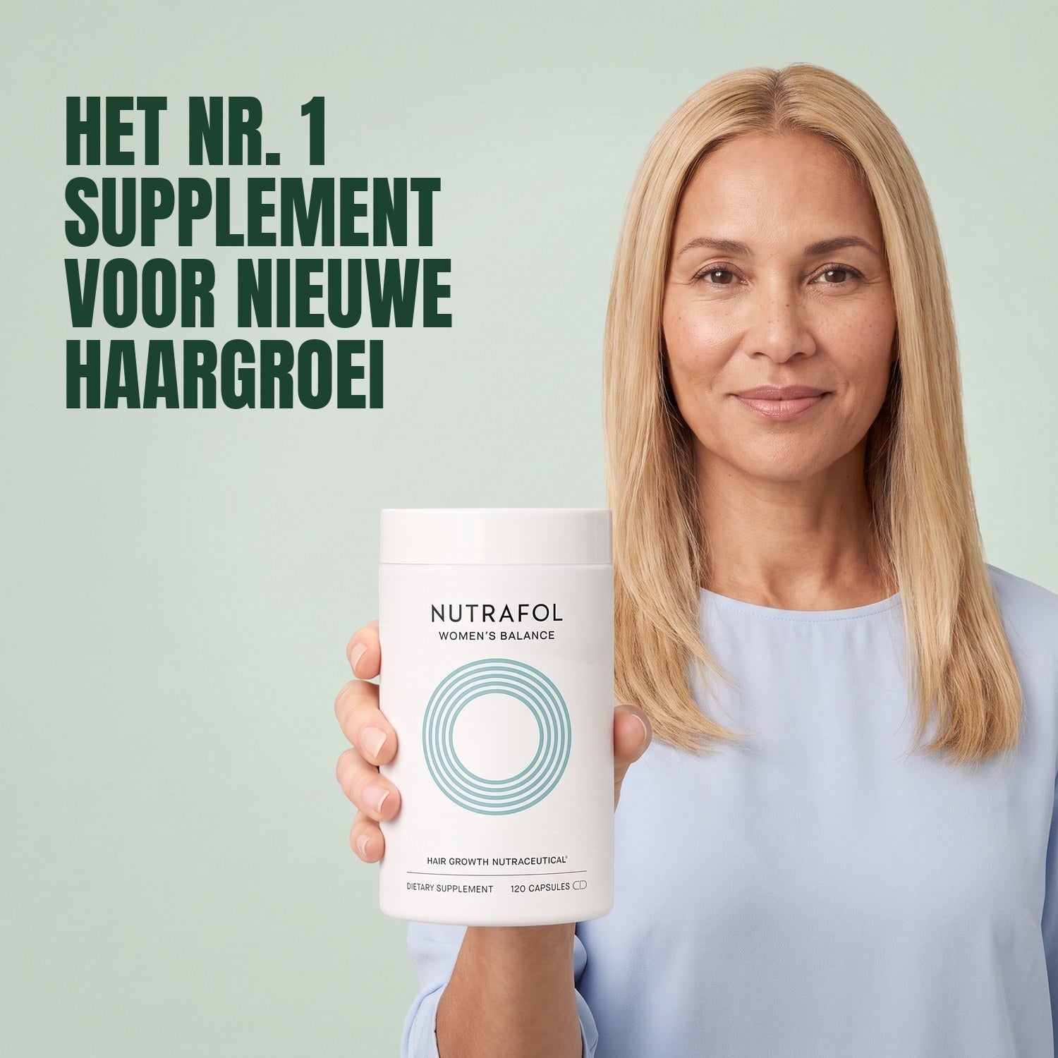 Woman holding the Nutrafol for Women 45+ supplement box against a green background