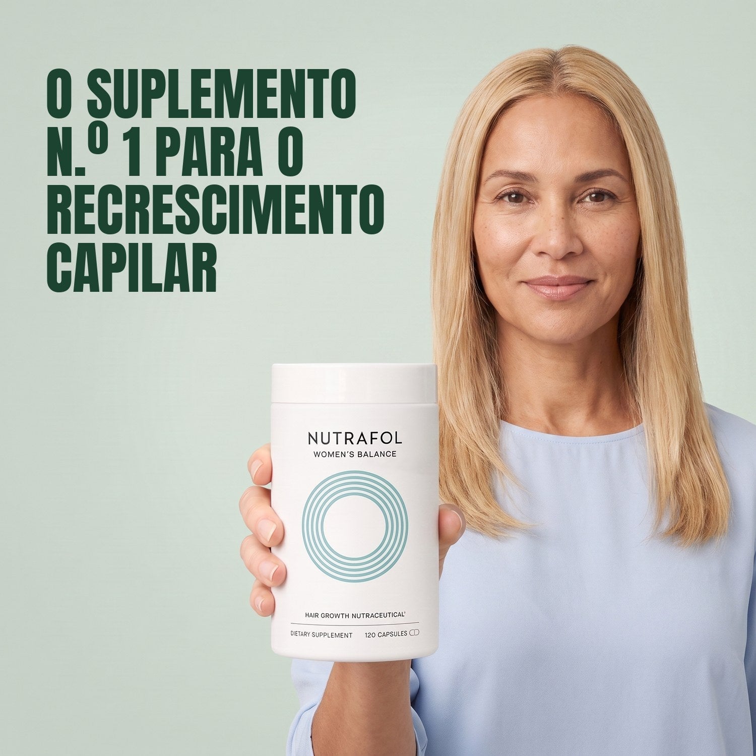 Woman holding the Nutrafol for Women 45+ supplement box against a green background