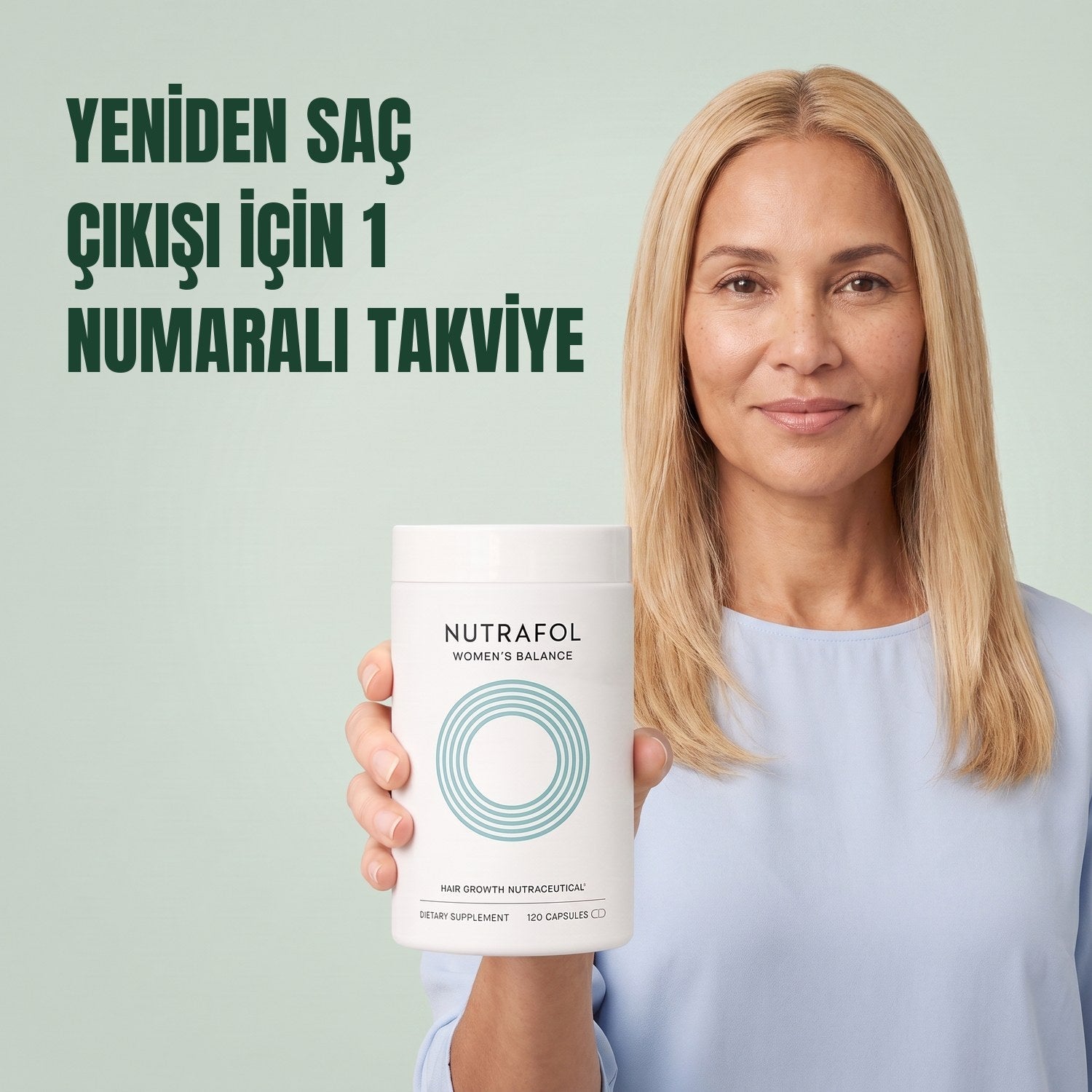 Woman holding the Nutrafol for Women 45+ supplement box against a green background