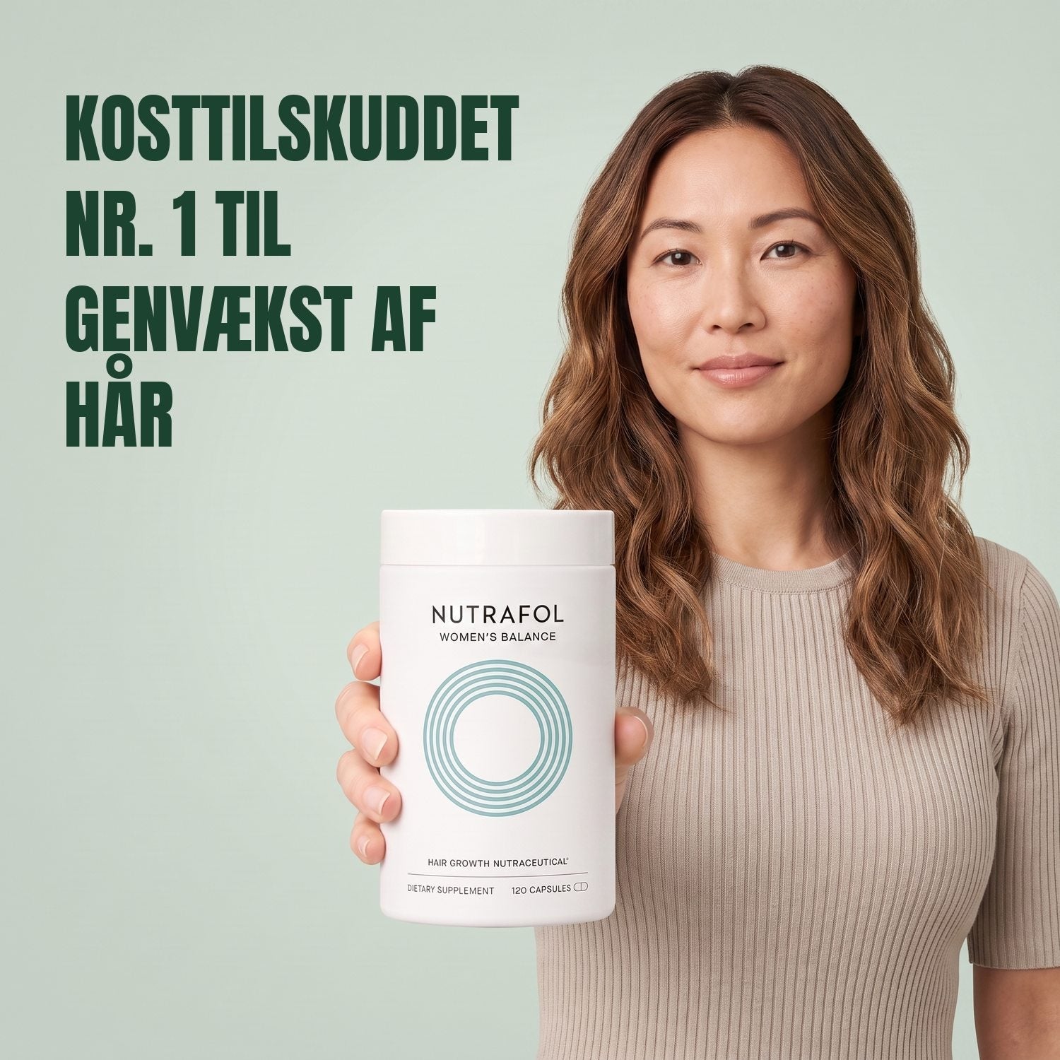 Woman holding the Nutrafol for Women 45+ supplement box against a green background