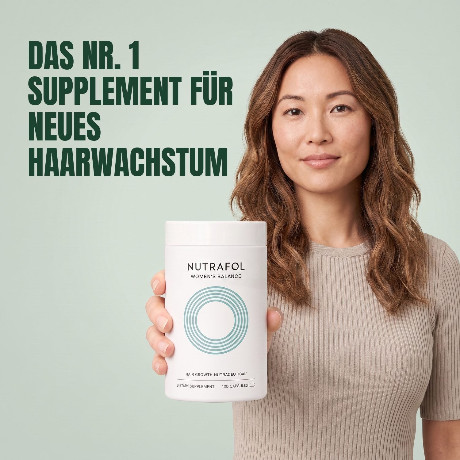 Woman holding the Nutrafol for Women 45+ supplement box against a green background