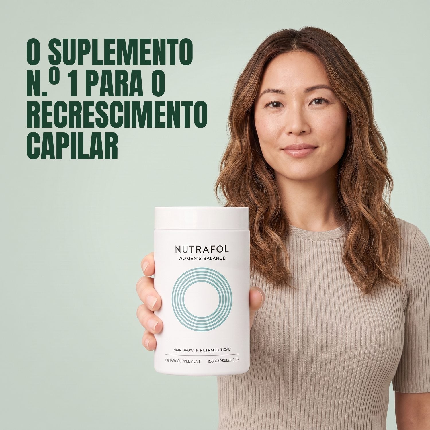 Woman holding the Nutrafol for Women 45+ supplement box against a green background