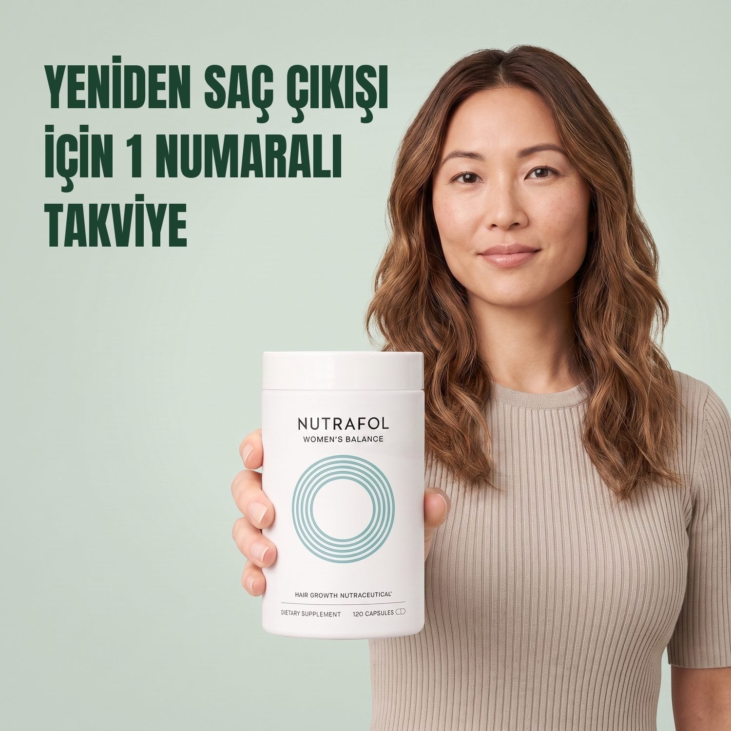 Woman holding the Nutrafol for Women 45+ supplement box against a green background