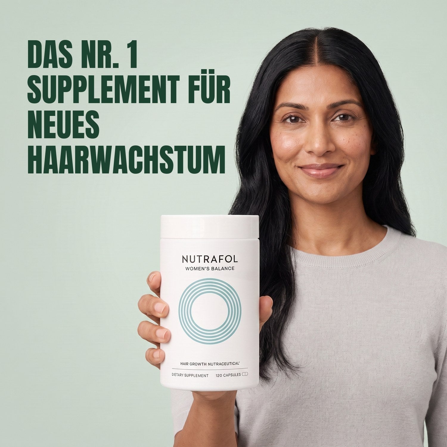 Woman holding the Nutrafol for Women 45+ supplement box against a green background