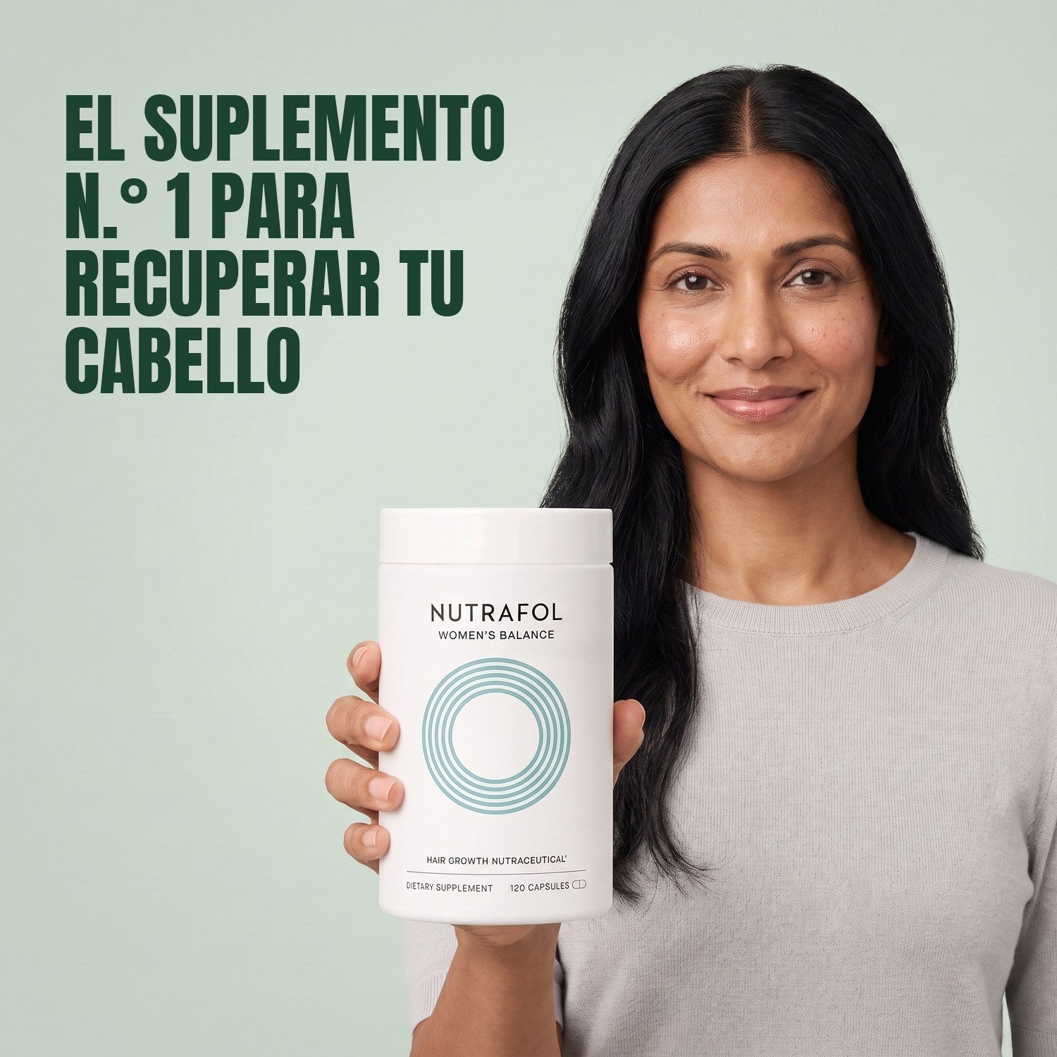 Woman holding the Nutrafol for Women 45+ supplement box against a green background