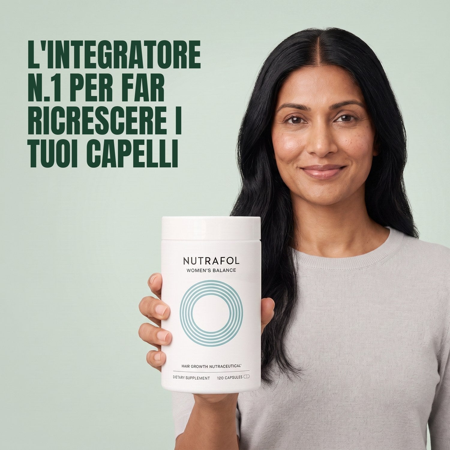 Woman holding the Nutrafol for Women 45+ supplement box against a green background