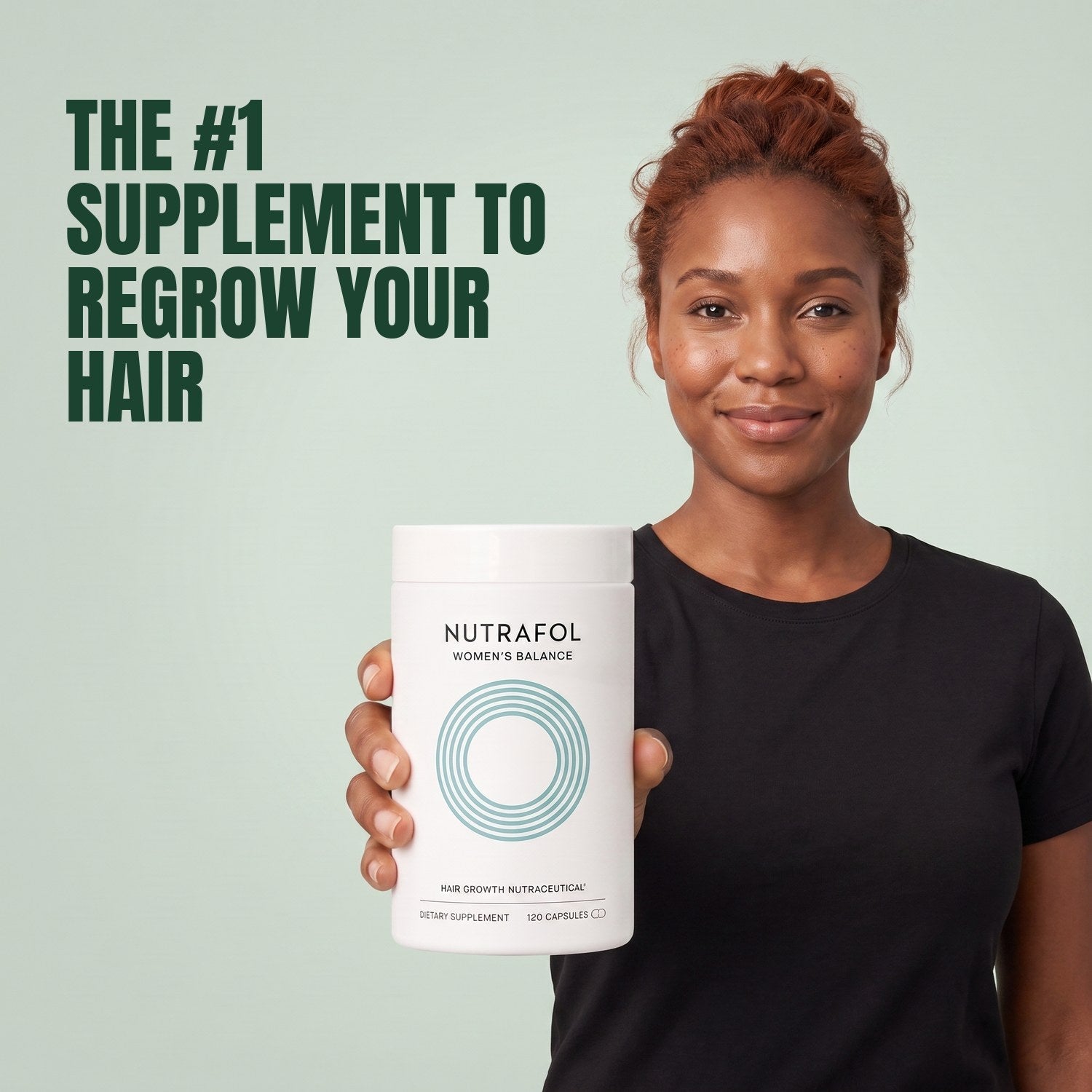 Woman holding the Nutrafol for Women 45+ supplement box against a green background