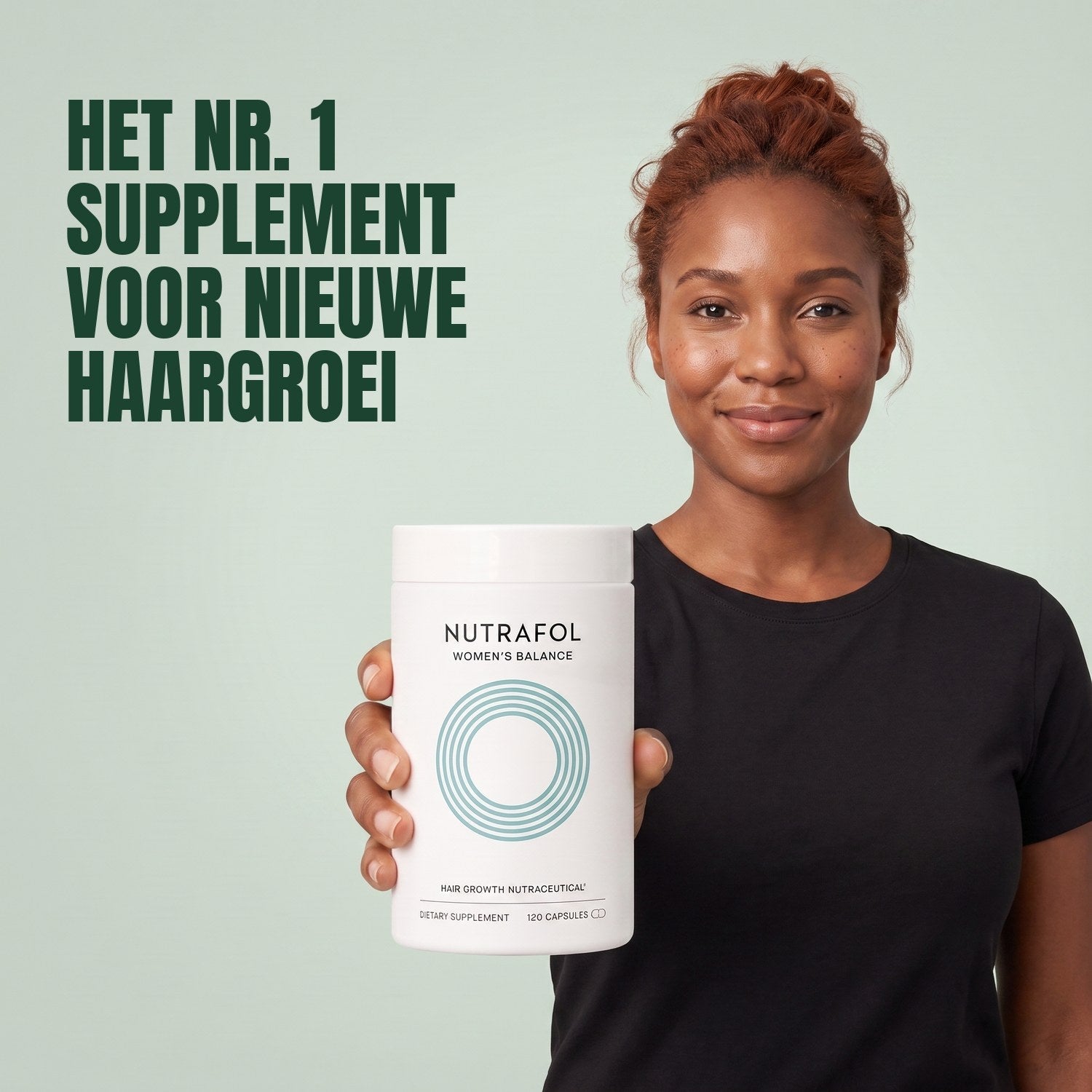 Woman holding the Nutrafol for Women 45+ supplement box against a green background