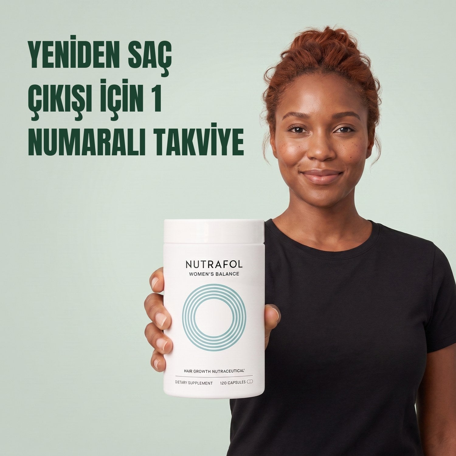 Woman holding the Nutrafol for Women 45+ supplement box against a green background