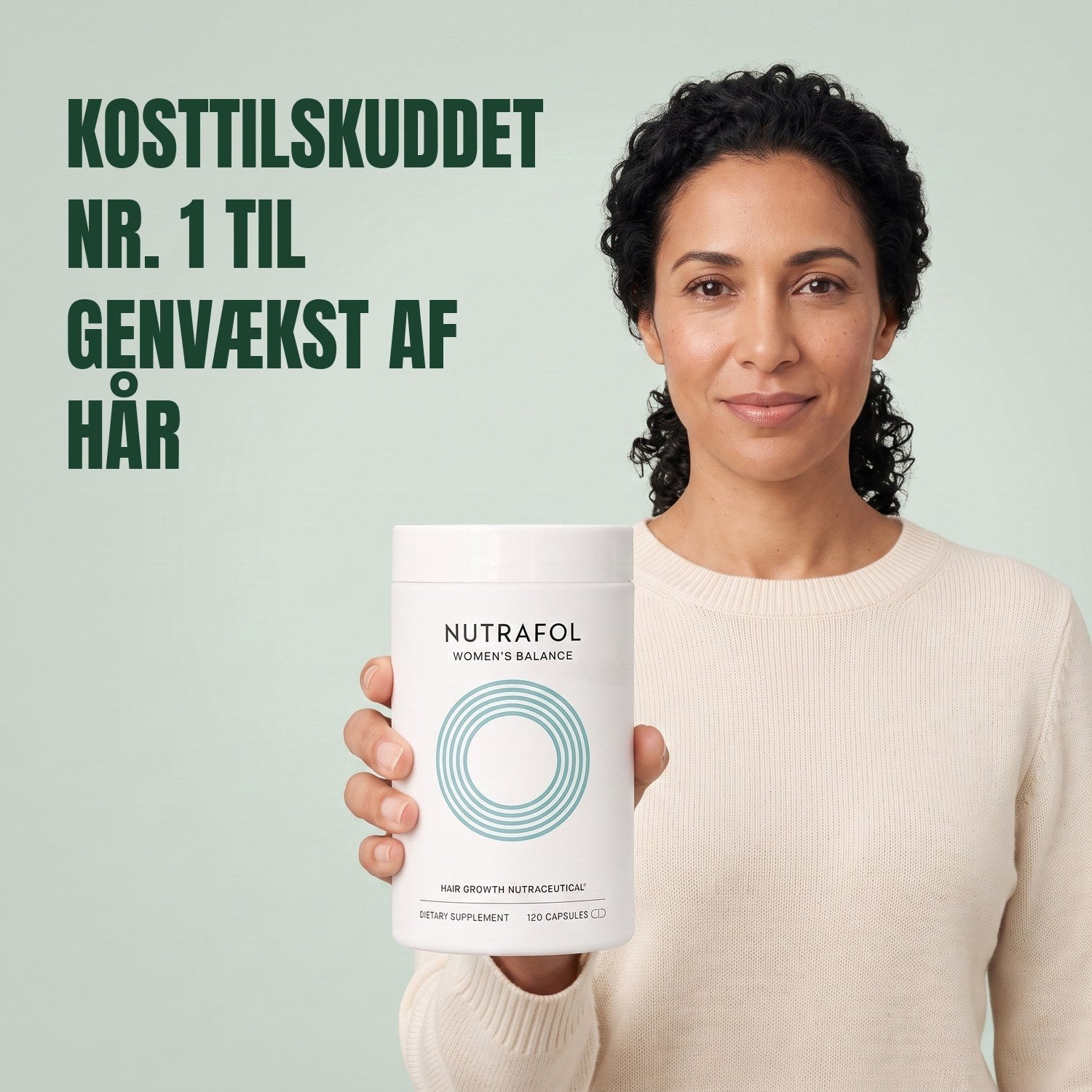 Woman holding the Nutrafol for Women 45+ supplement box against a green background