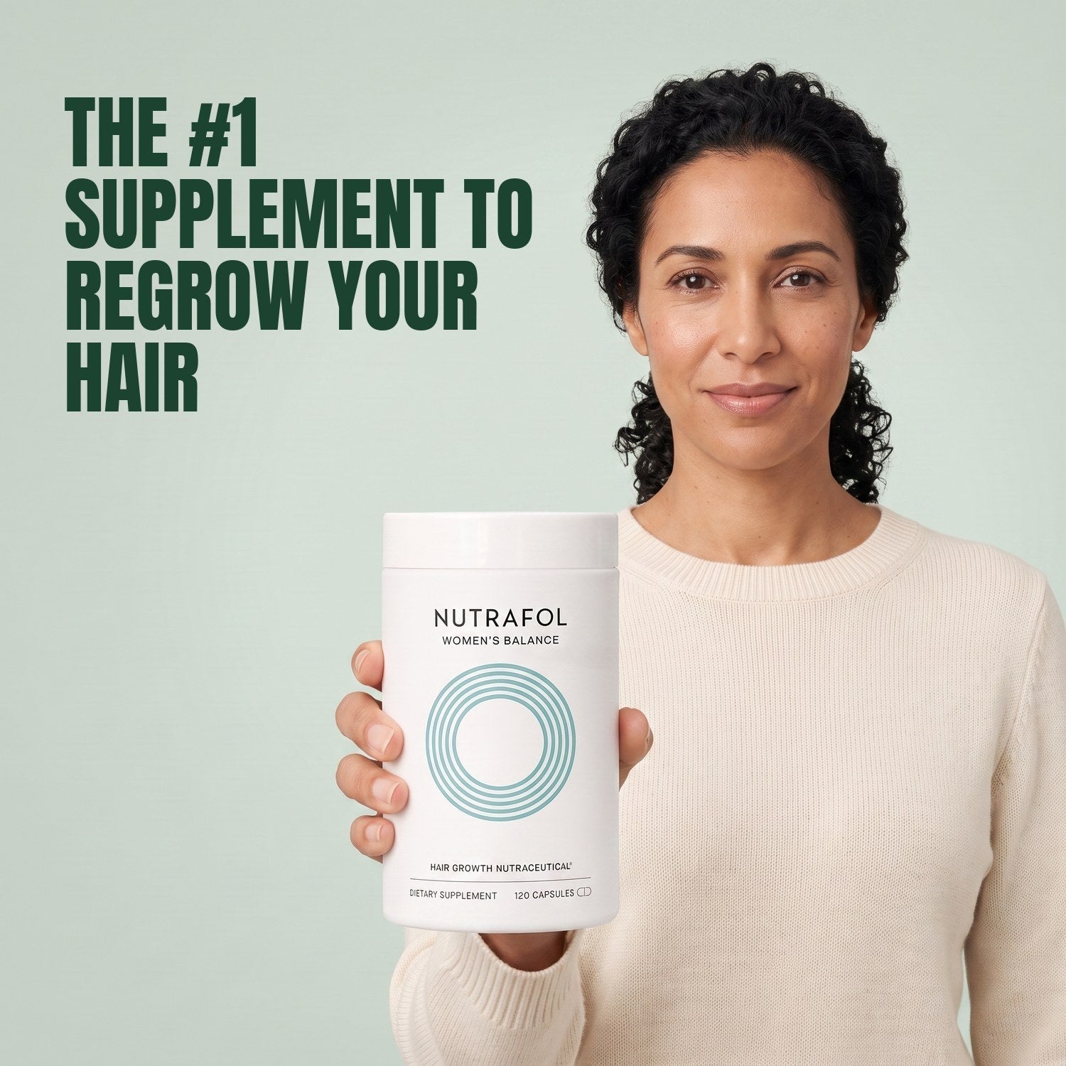 Woman holding the Nutrafol for Women 45+ supplement box against a green background