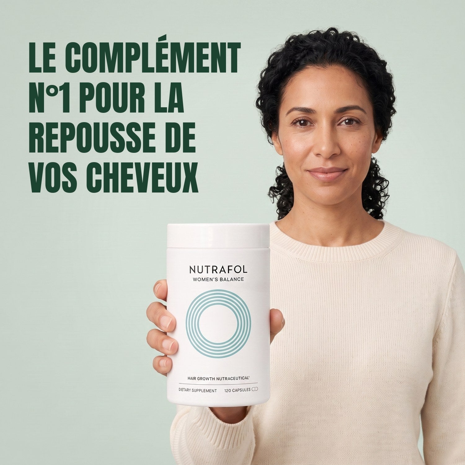 Woman holding the Nutrafol for Women 45+ supplement box against a green background