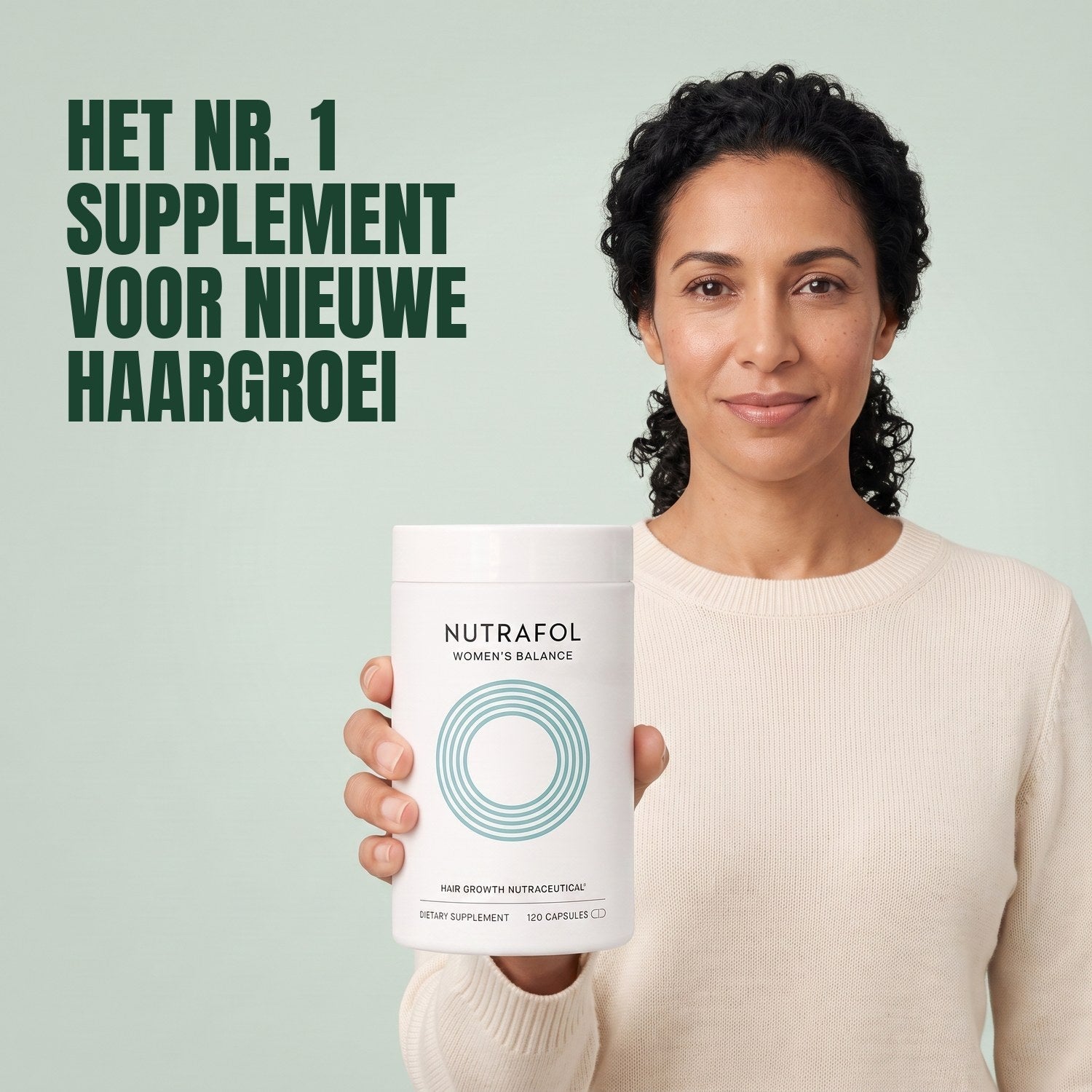 Woman holding the Nutrafol for Women 45+ supplement box against a green background