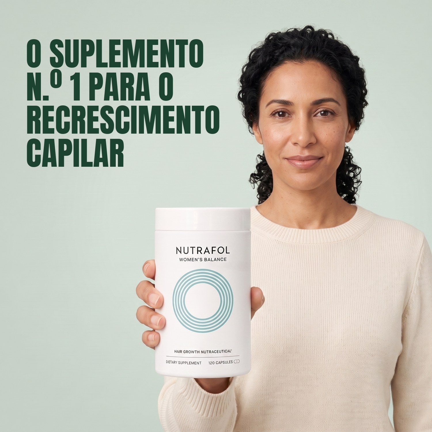 Woman holding the Nutrafol for Women 45+ supplement box against a green background
