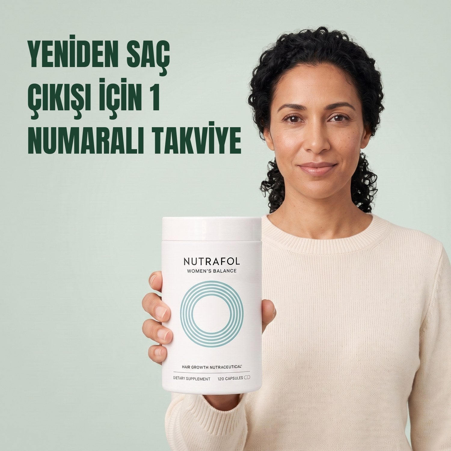 Woman holding the Nutrafol for Women 45+ supplement box against a green background