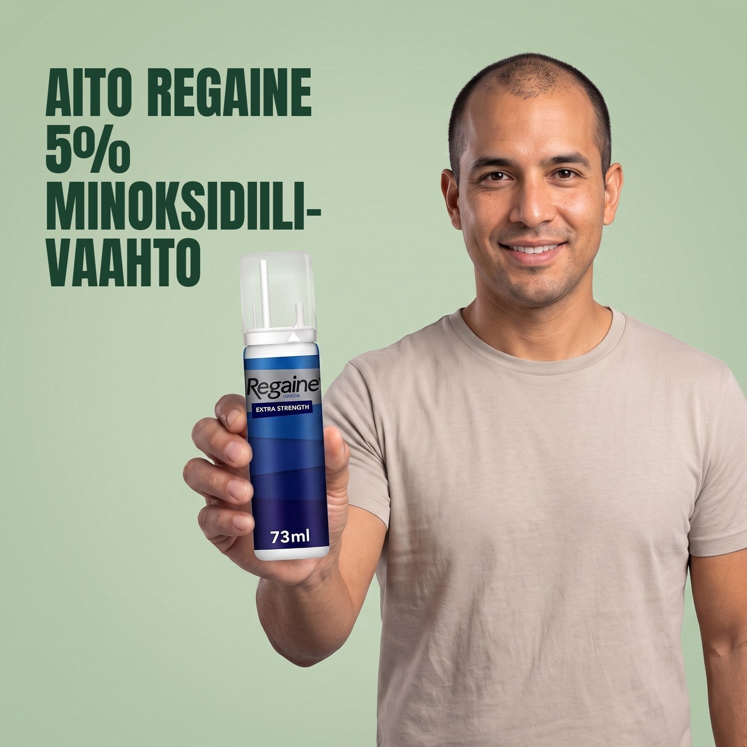 Man holding the Regaine for Men Minoxidil 5% foam pack against a green background