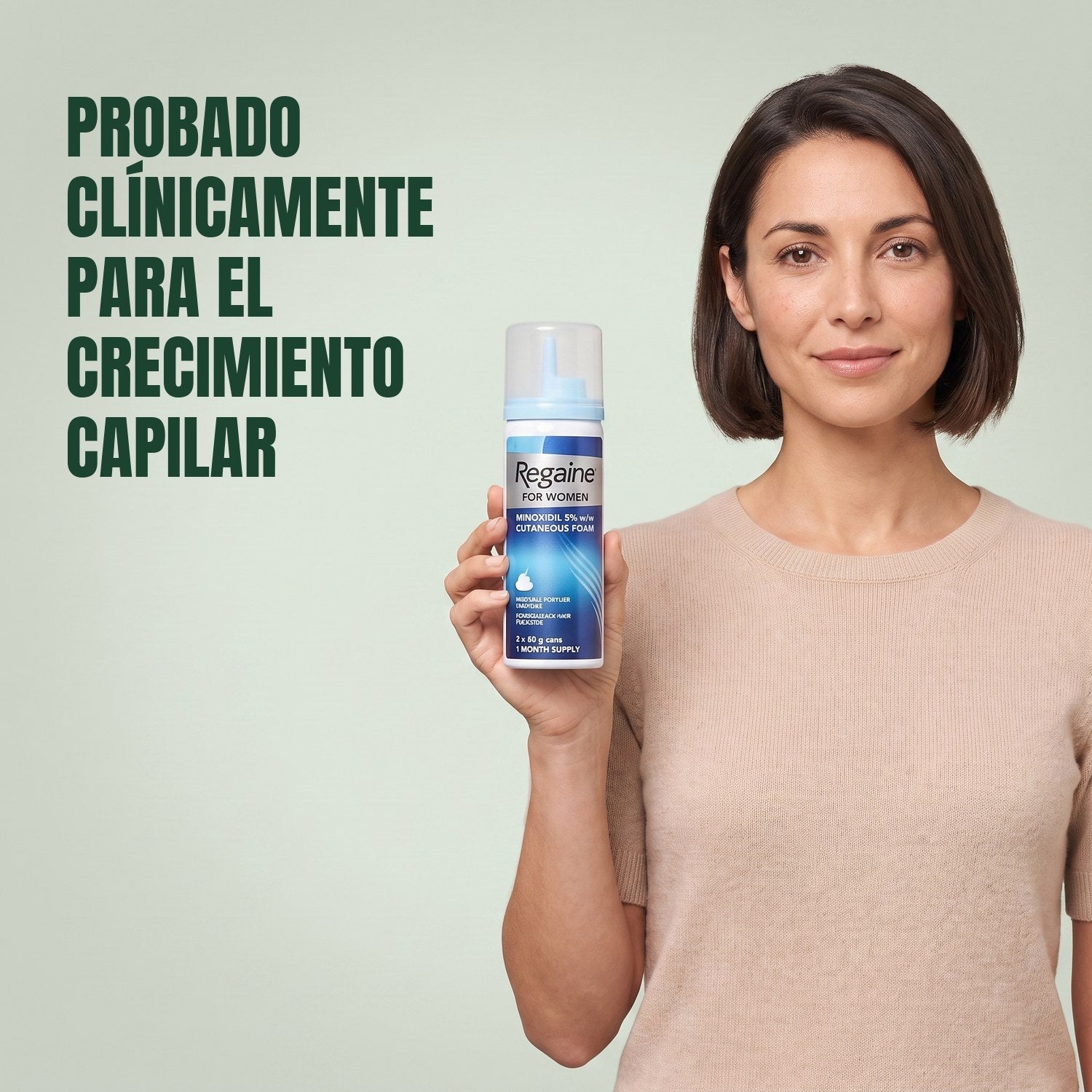 Woman holding the Regaine for Women Minoxidil 5% foam carton with a foam can against a green background