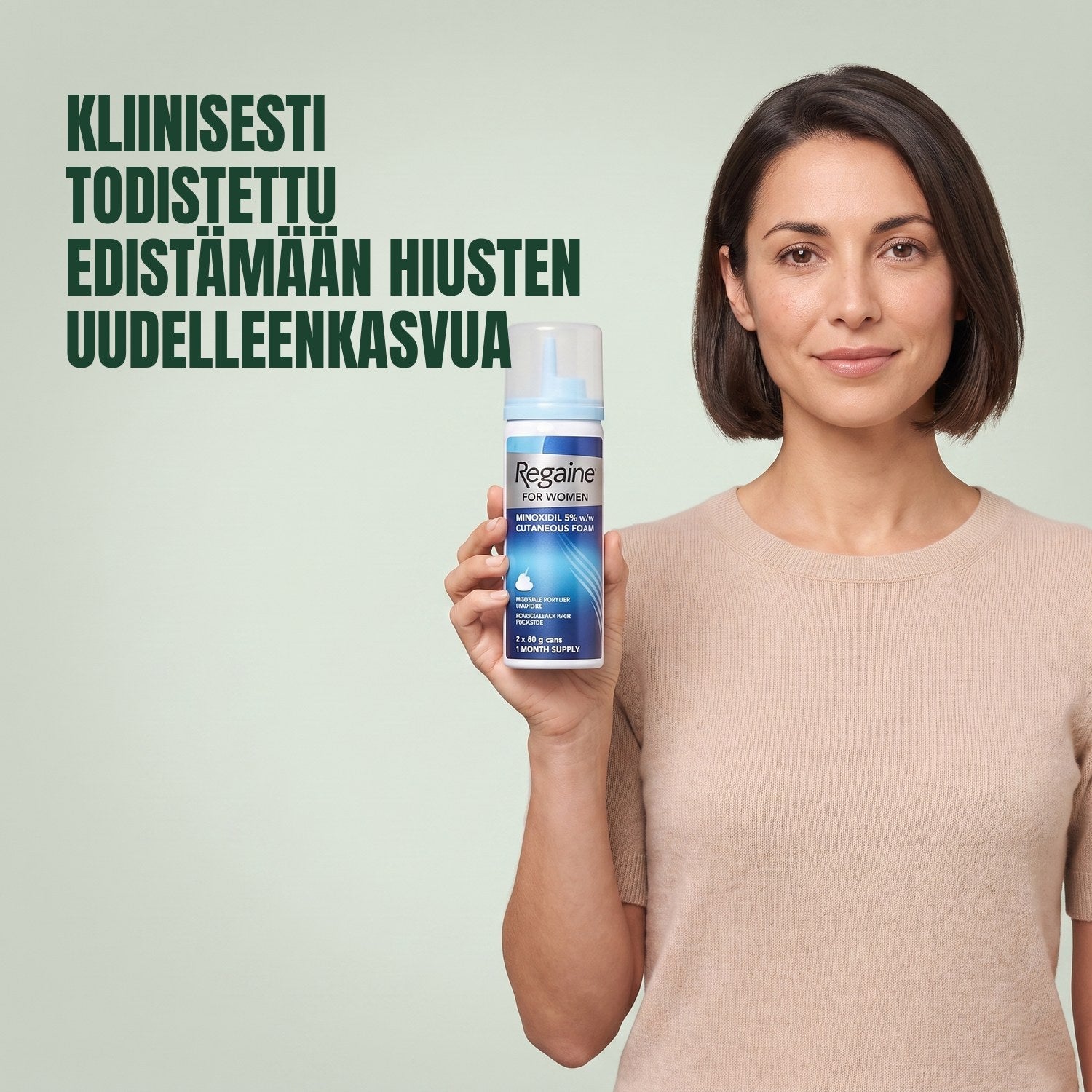Woman holding the Regaine for Women Minoxidil 5% foam carton with a foam can against a green background