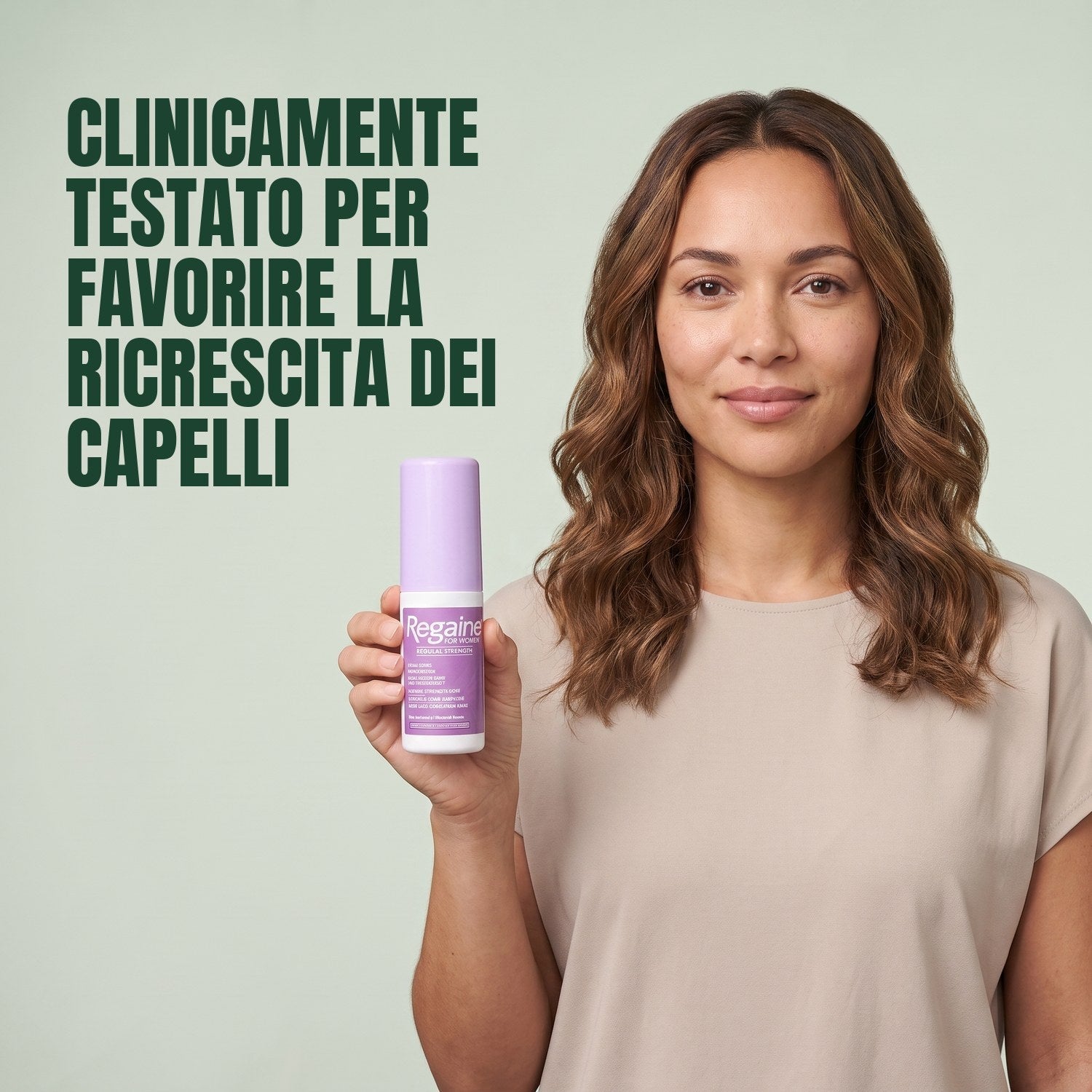 Woman holding the Regaine for Women Minoxidil 2% lotion pack against a green background