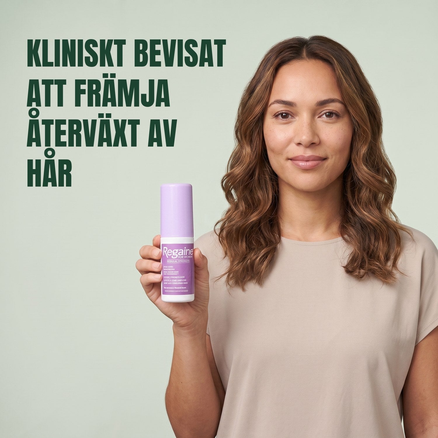 Woman holding the Regaine for Women Minoxidil 2% lotion pack against a green background