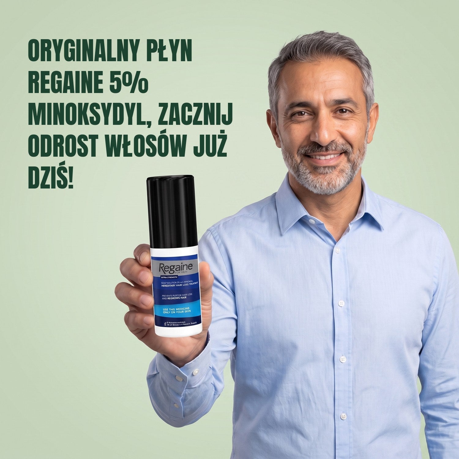 Man holding the Regaine for Men Minoxidil 5% lotion pack against a green background
