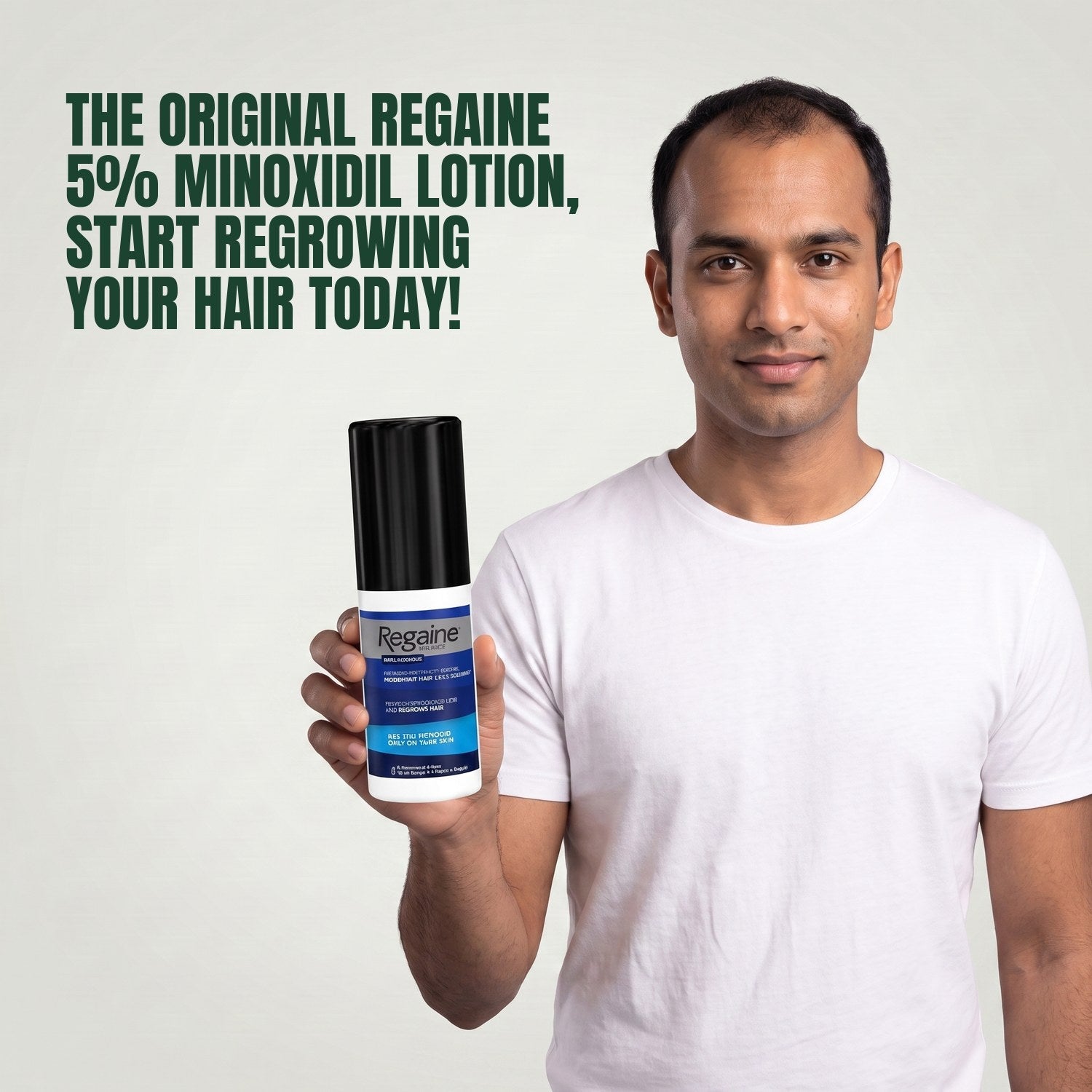 Man holding the Regaine for Men Minoxidil 5% lotion pack against a green background