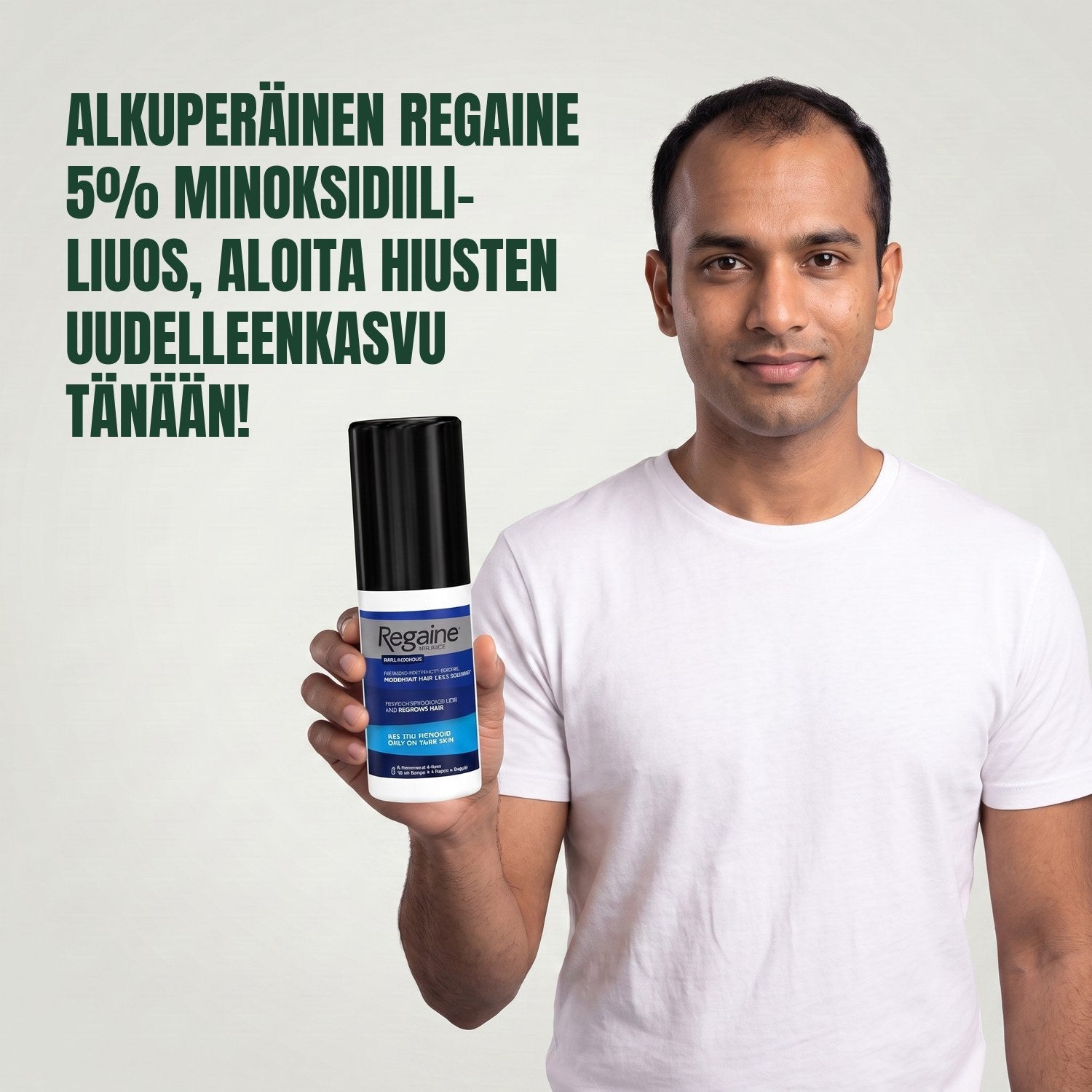 Man holding the Regaine for Men Minoxidil 5% lotion pack against a green background