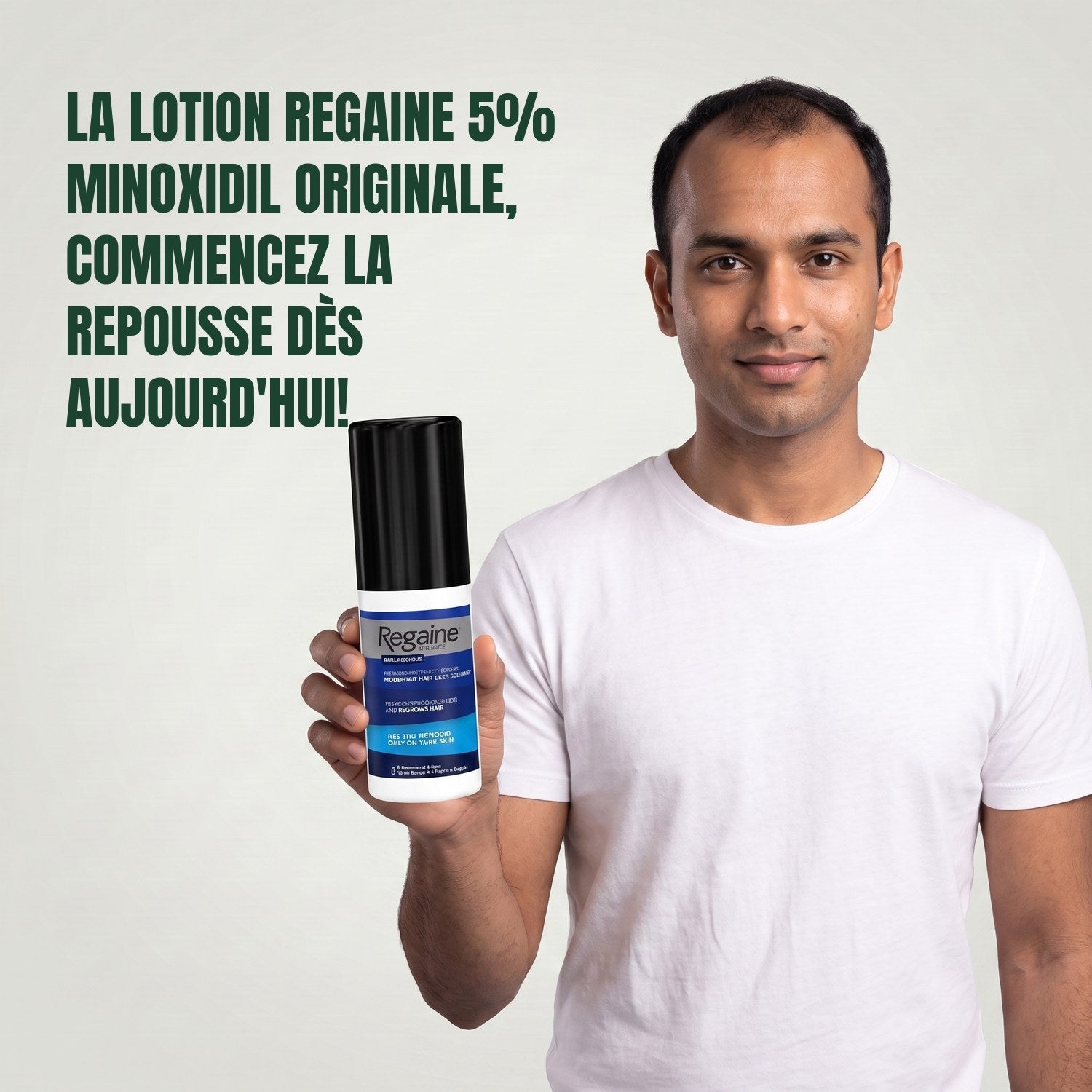 Man holding the Regaine for Men Minoxidil 5% lotion pack against a green background
