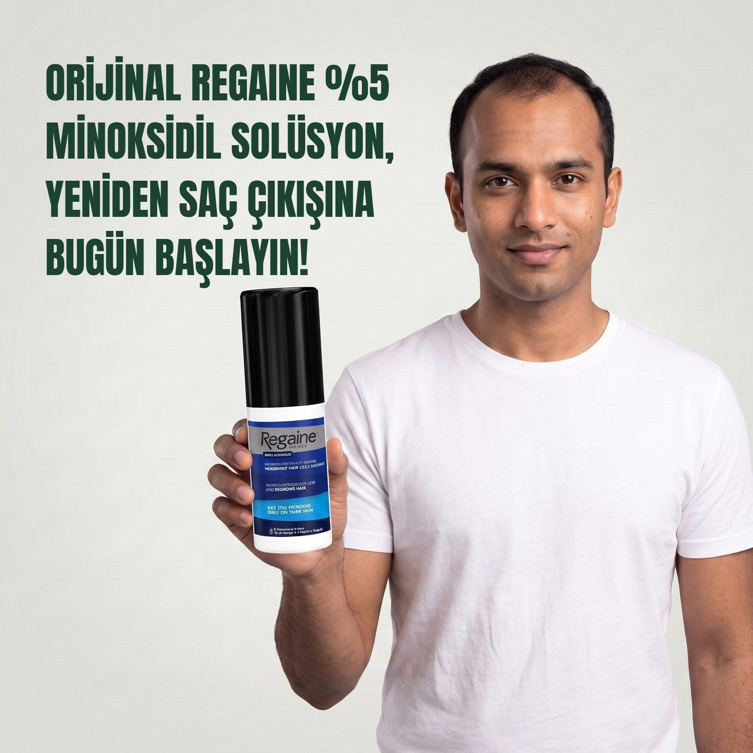Man holding the Regaine for Men Minoxidil 5% lotion pack against a green background