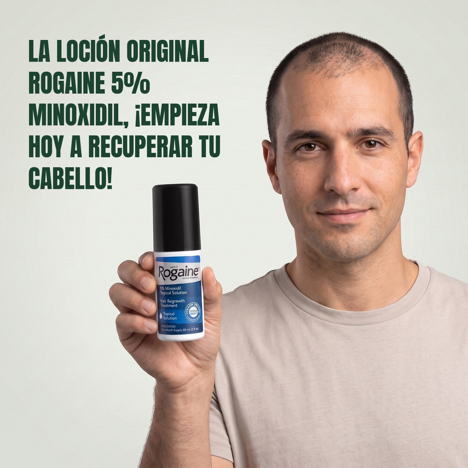 Man holding the Rogaine 5% minoxidil topical solution carton against a green background