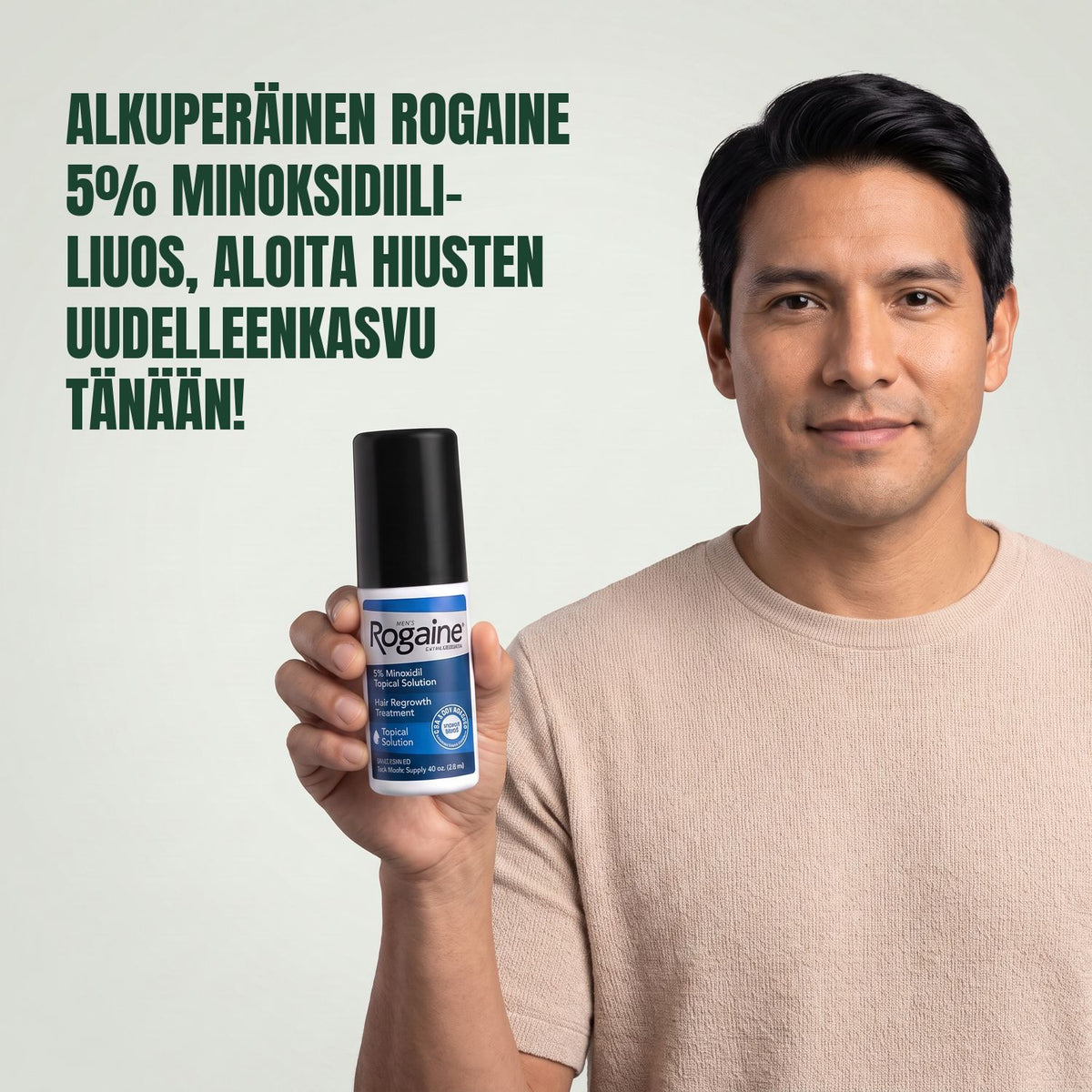 Man holding the Rogaine 5% minoxidil topical solution carton against a green background