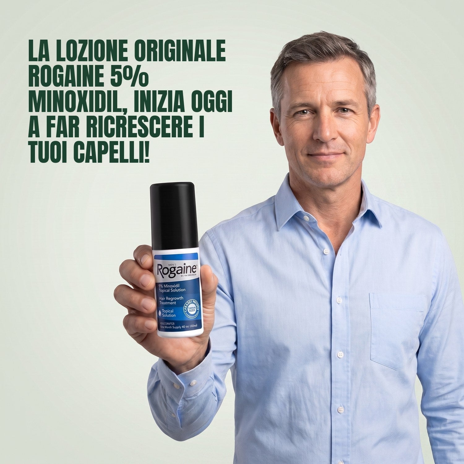 Man holding the Rogaine 5% minoxidil topical solution carton against a green background