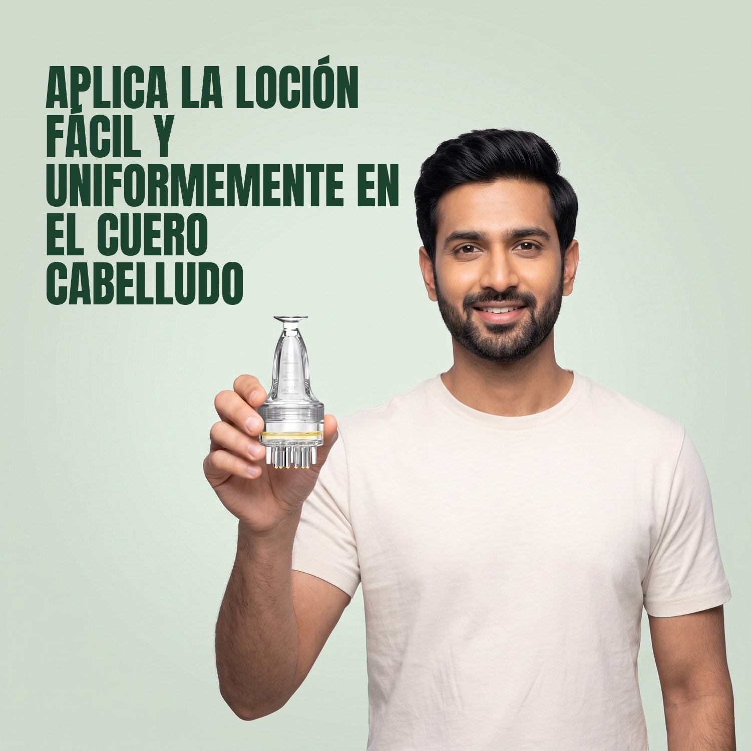 Man holding a basic minoxidil lotion applicator against a green background
