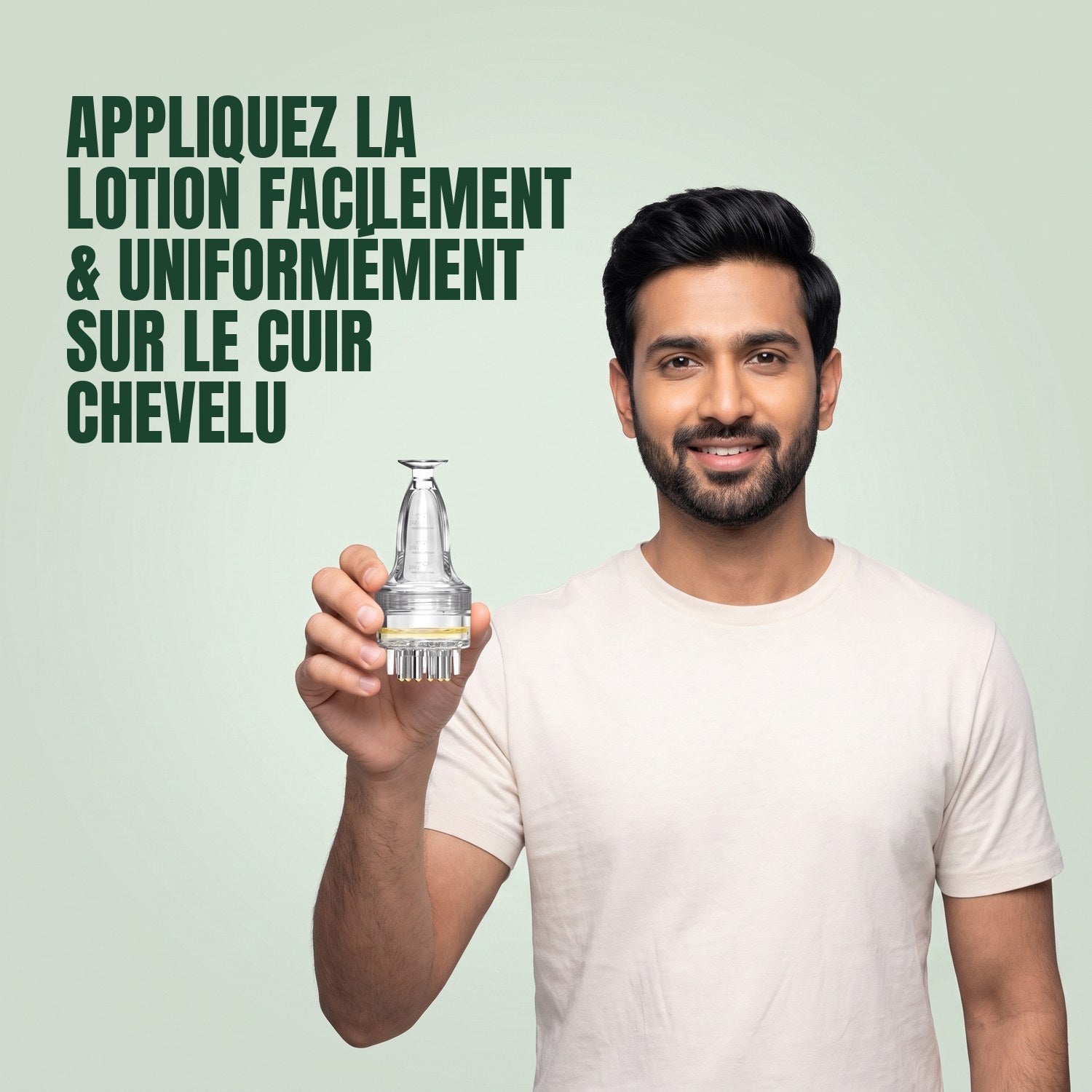 Man holding a basic minoxidil lotion applicator against a green background