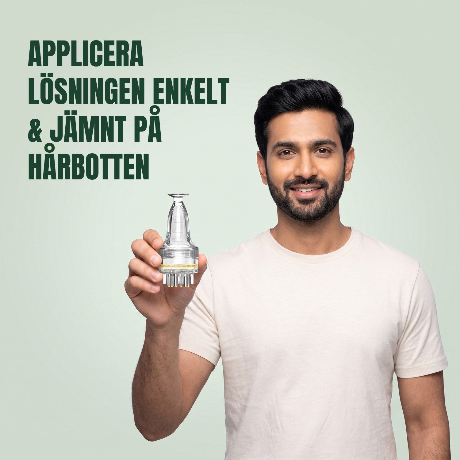 Man håller en enkel applikator för minoxidillösning mot en grön bakgrund